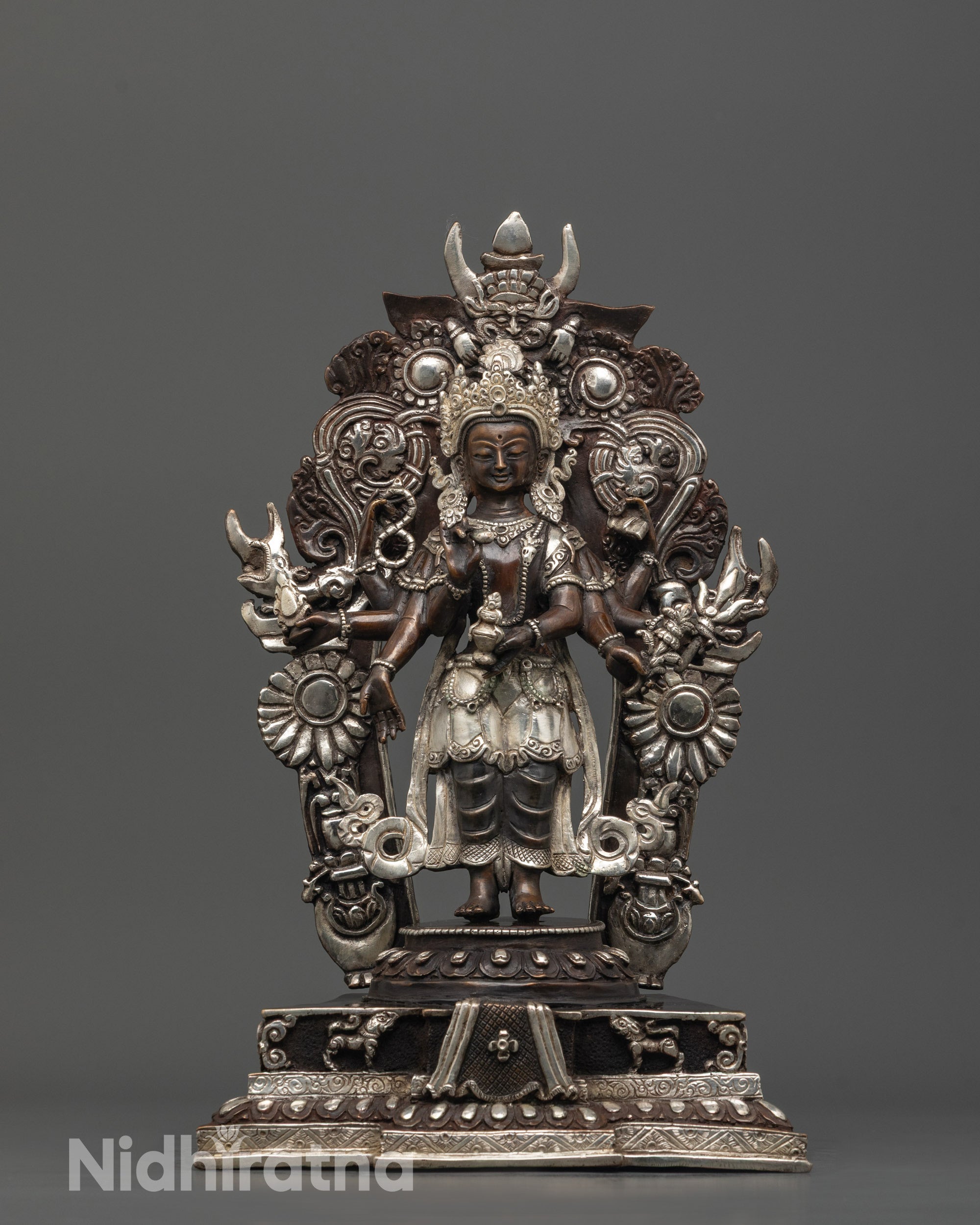 Front view of Hand-carved Lokeshwor statue with eight arms made from oxidized copper