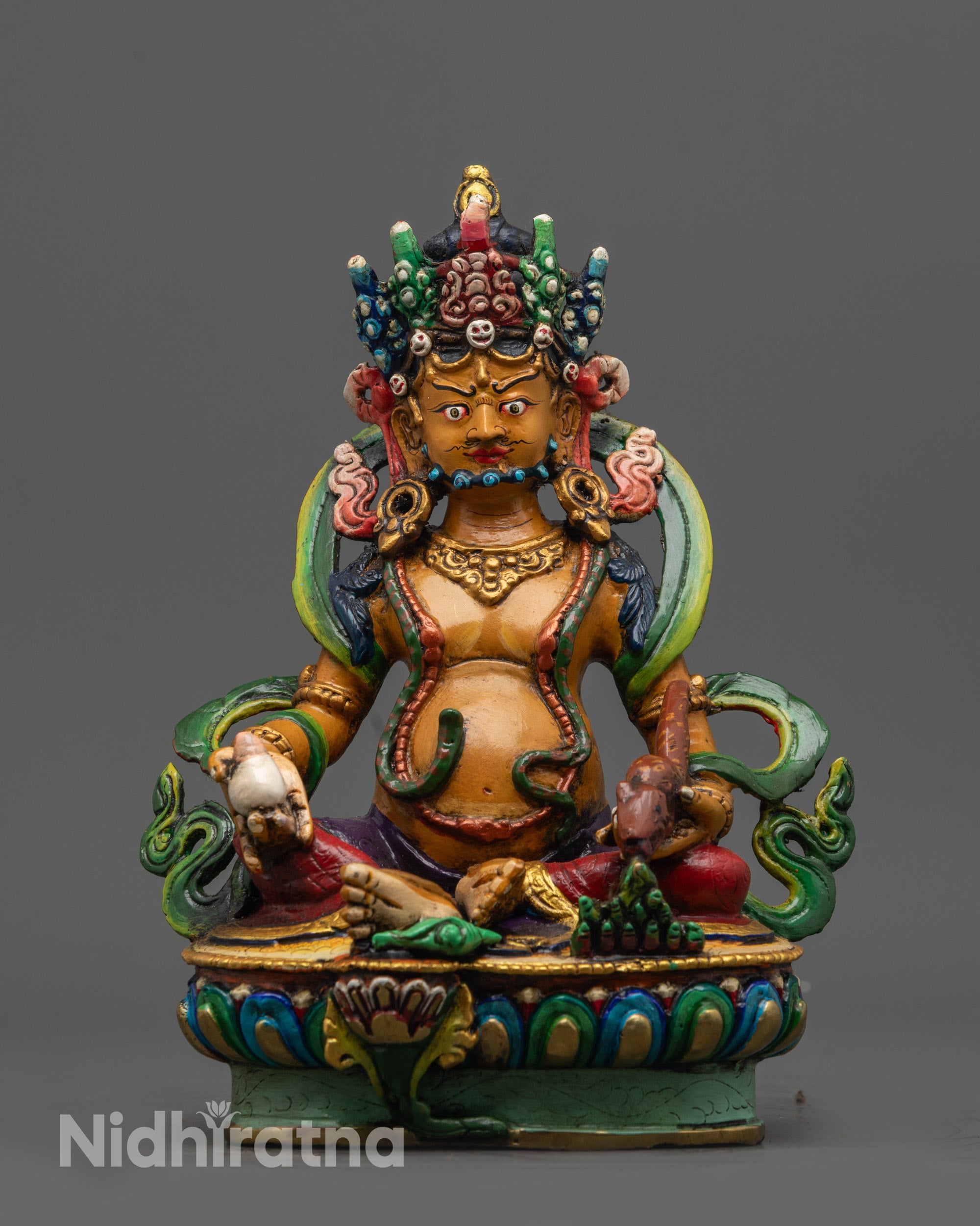 Front view of Hand-painted Dzambhala Statue with orange-hued body on lotus seat