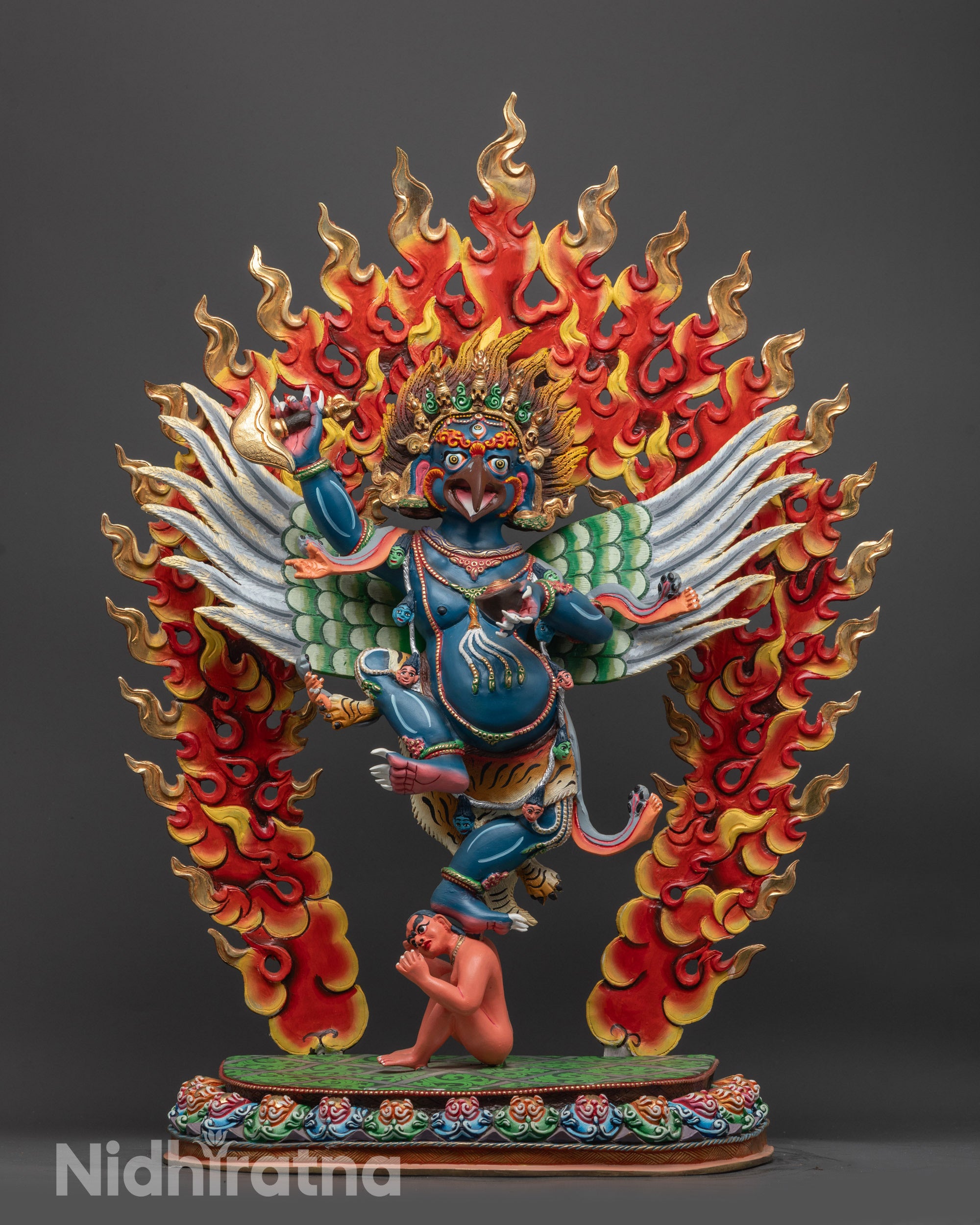 Front view of Handcrafted Garuda Statue with blue body and five-skull crown on lotus seat