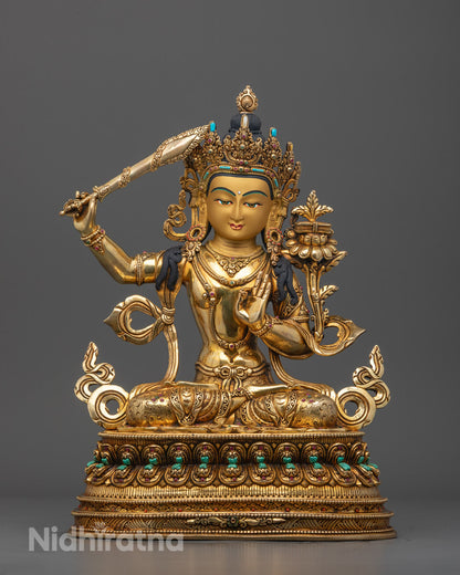 Front view of Handcrafted Tibetan Manjushri Sculpture with gold-gilded face and lotus throne
