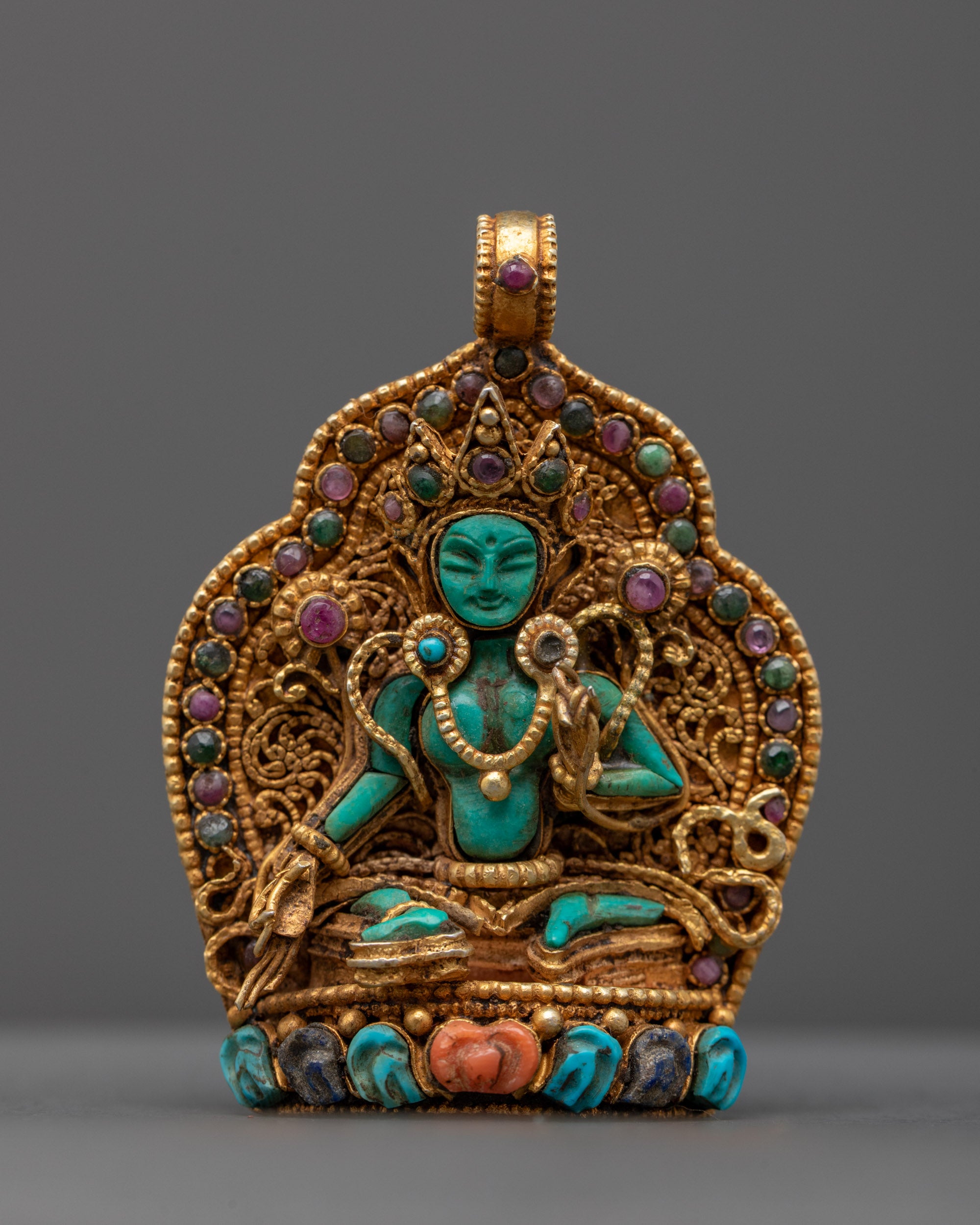 Front view of Handmade Green Tara Locket with radiant green crystal and gold-gilded filigree, crafted by master artisans from Patan, Nepal.
