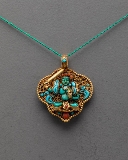 Front view of Handmade Manjushri Locket featuring radiant green crystal and gold-gilded filigree, crafted by master artisans from Patan, Nepal.