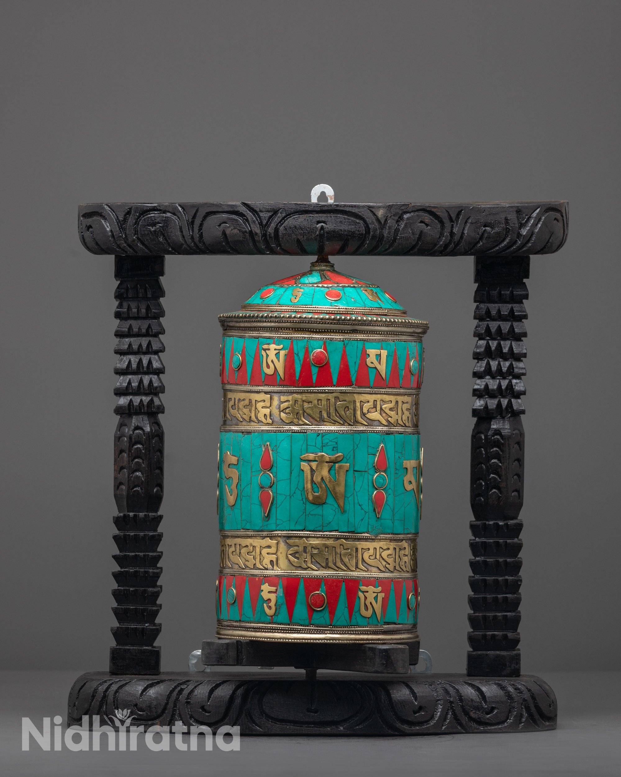 Front view of Handmade Tibetan Prayer Wheel with copper body and dark wood frame
