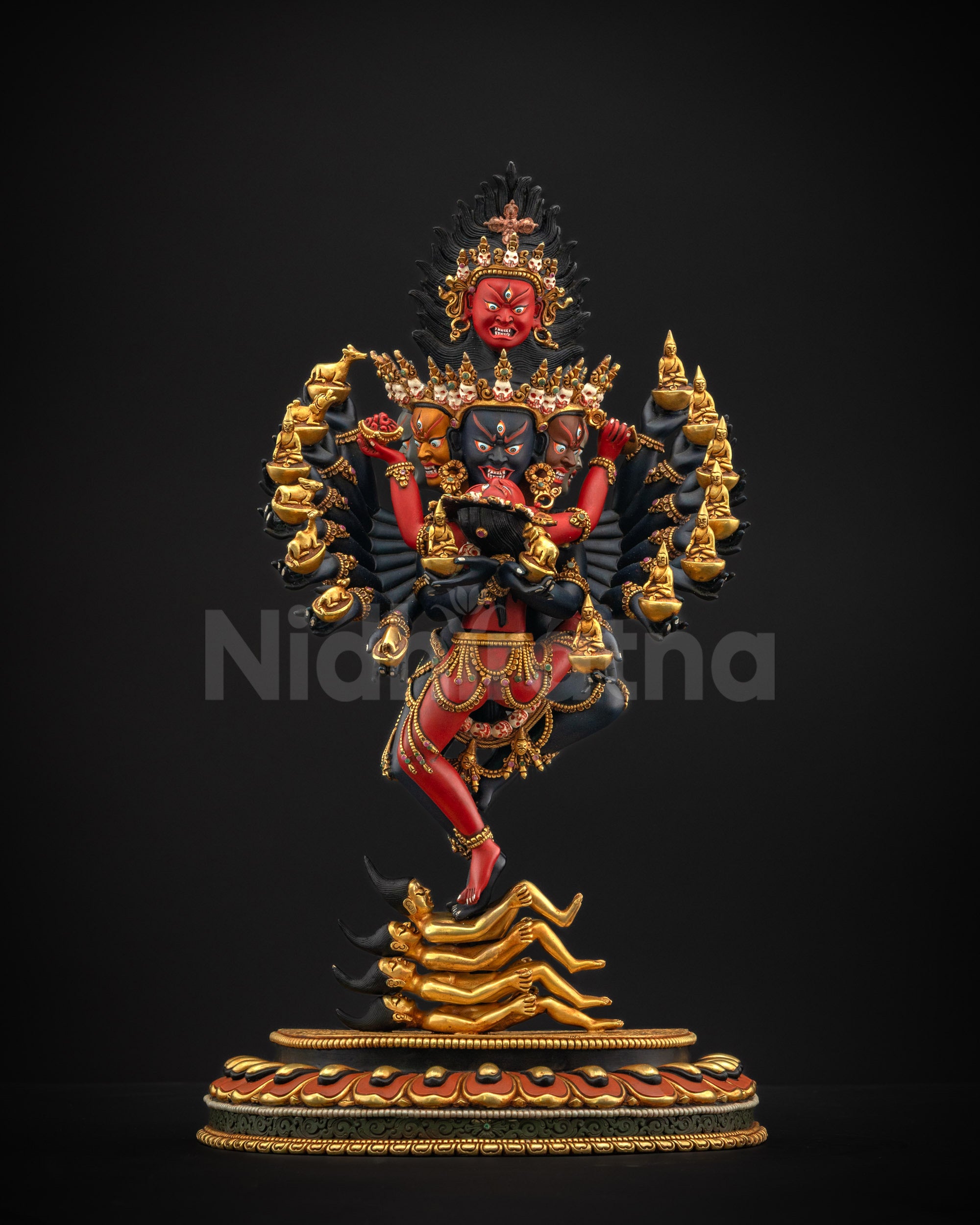 Front view of Hevajra Yab Yum statue with golden ornaments and lotus seat