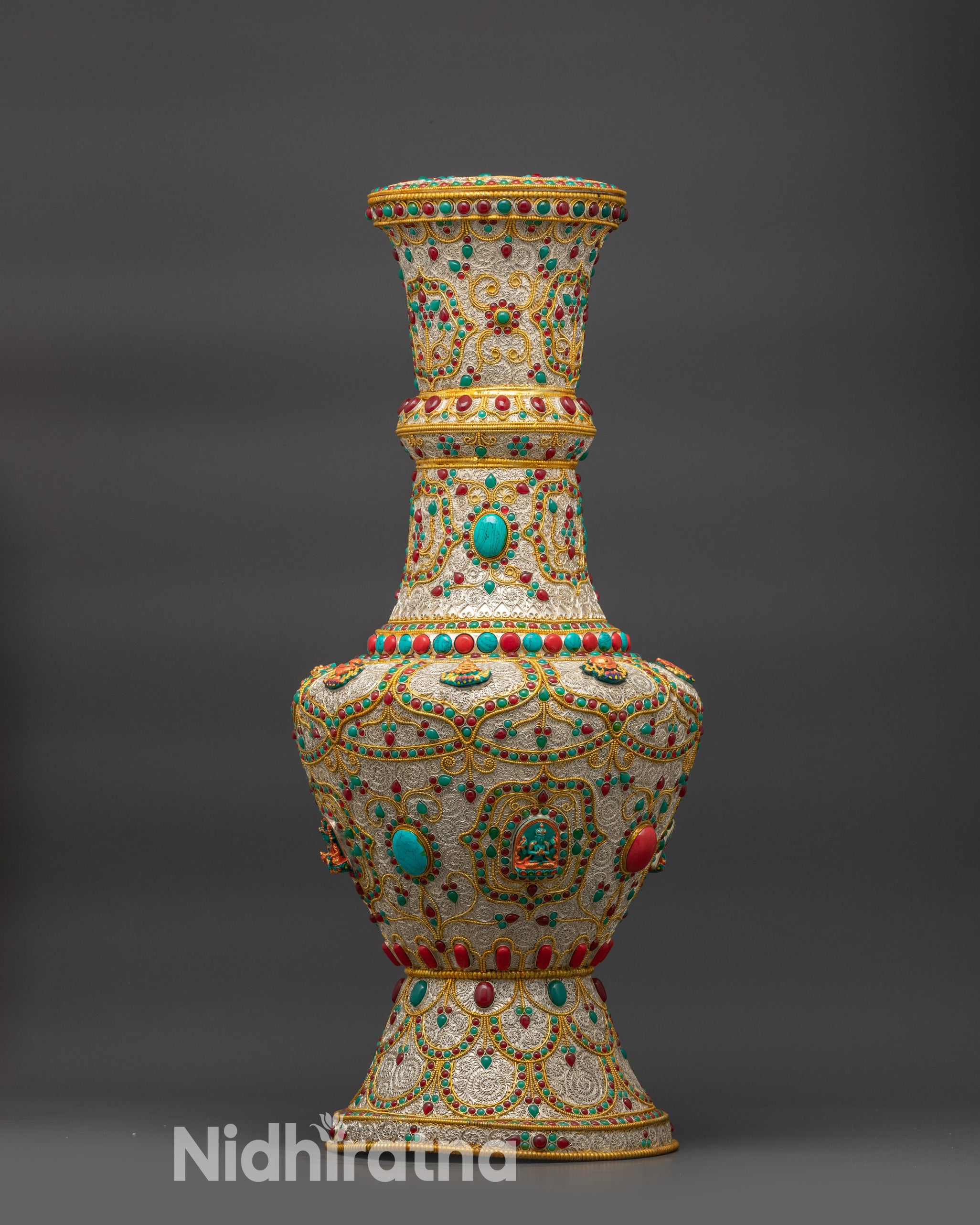 Front view of Himalayan Flower Vase handcrafted in Nepal, featuring silver and gold-plated filigree design with semi-precious stones and Buddhist deities.