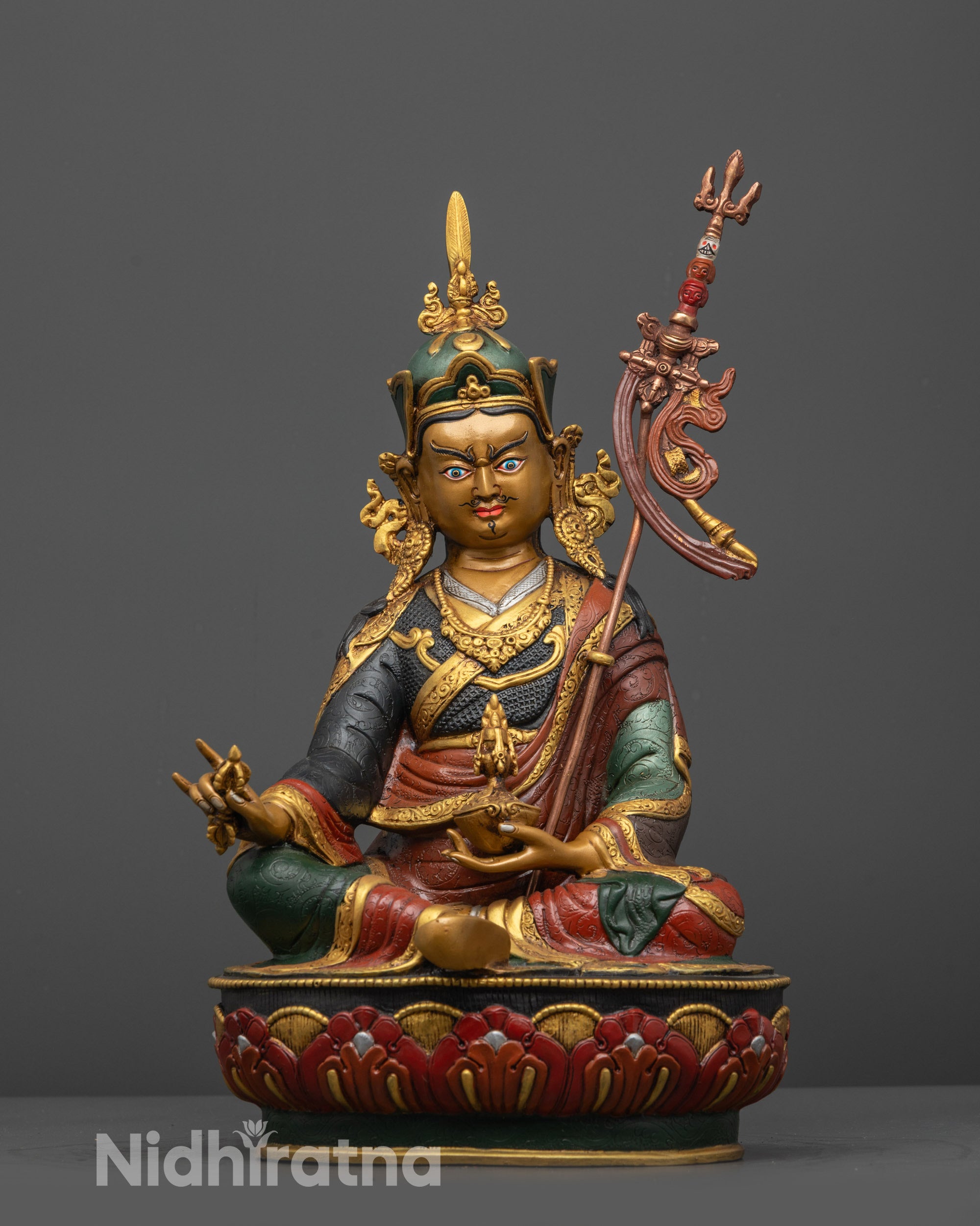 Front view of Himalayan Guru Padmasambhava statue with gold-plated robe and lotus seat