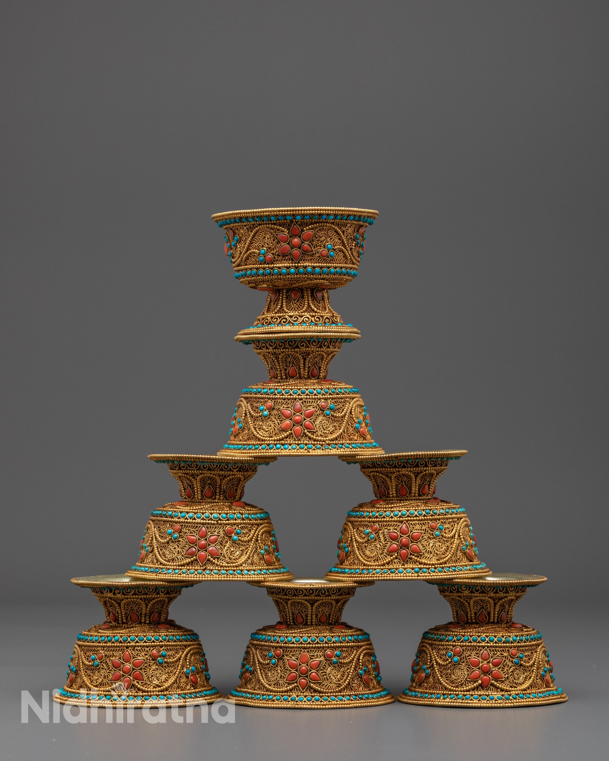 Front view of Himalayan water offering bowl with gold filigree and gemstone inlay