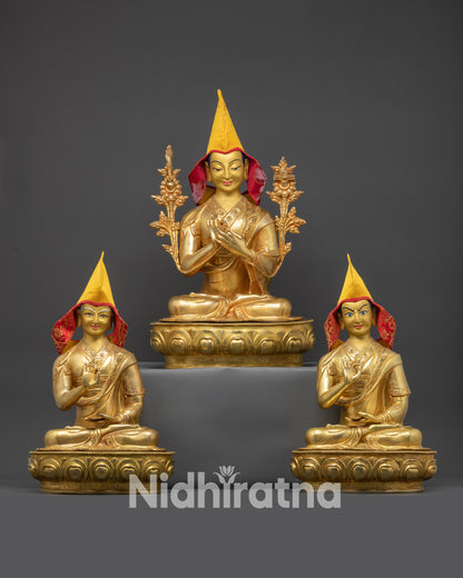 Front view of Je Tsongkhapa with disciples Gyaltsab Je and Khedrup Je, yellow Pandita hats, gold-gilded faces, and monastic robes.