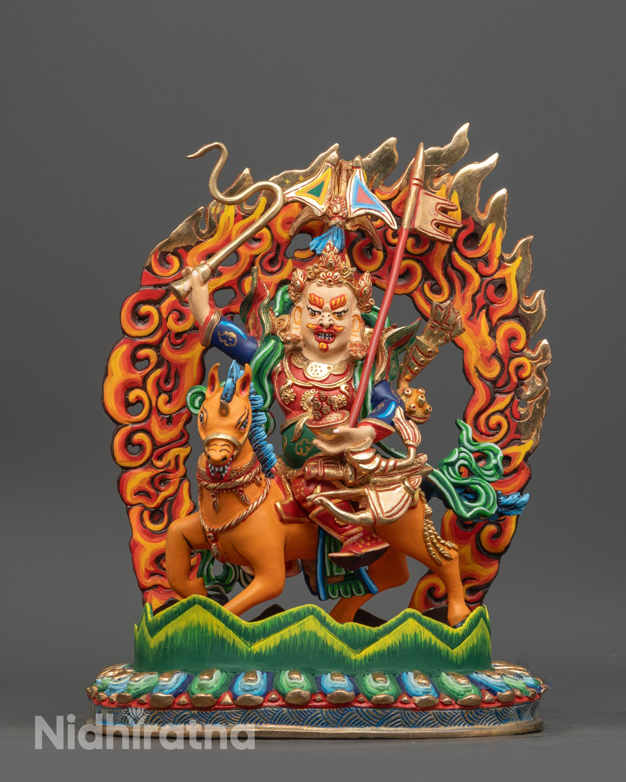 Front view of King Gesar statue riding horse in warrior form on copper base with colors