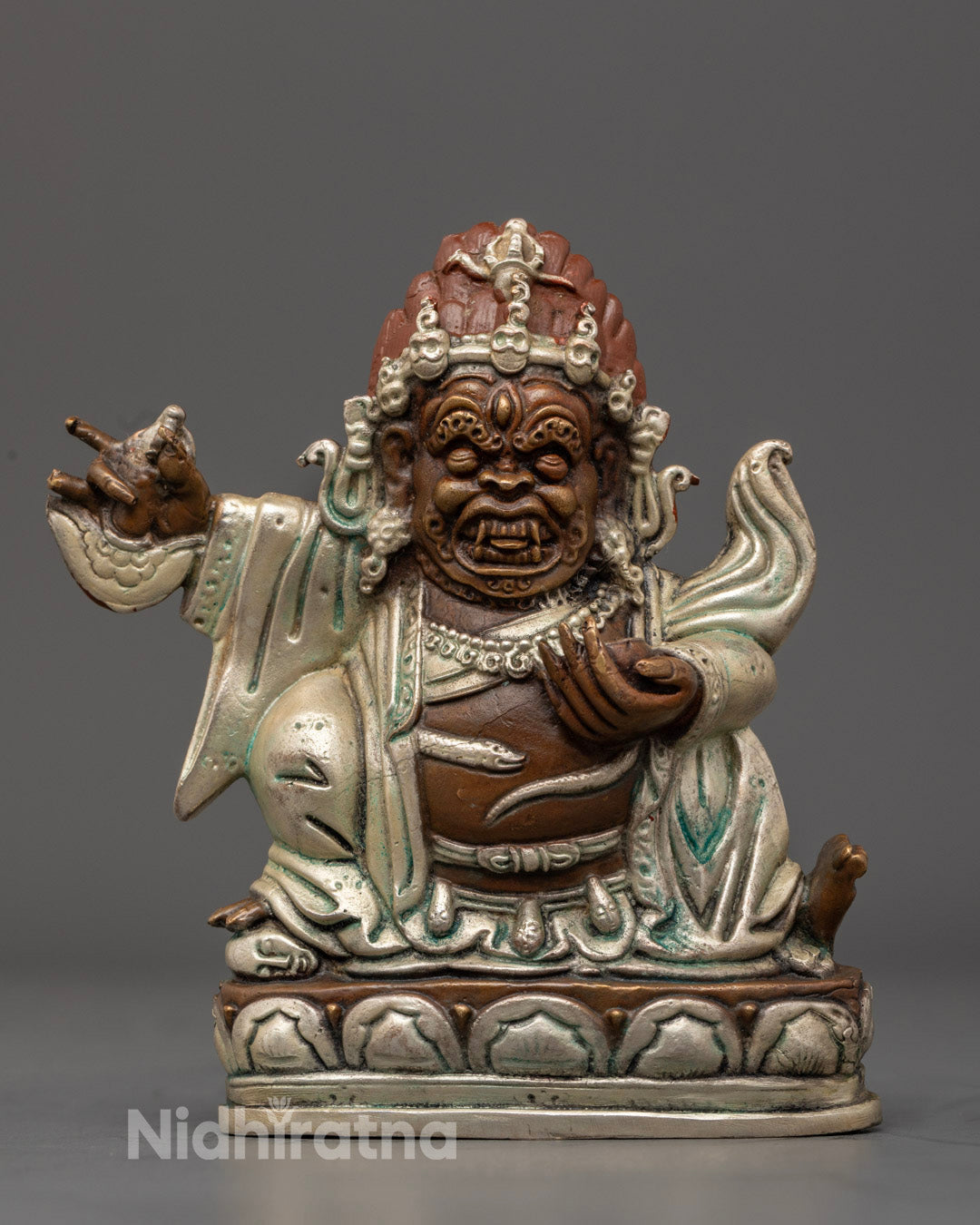Mahakala Bernagchen Statue in wrathful pose, handcrafted in oxidized copper with silver-plated finish and colorful detailing.