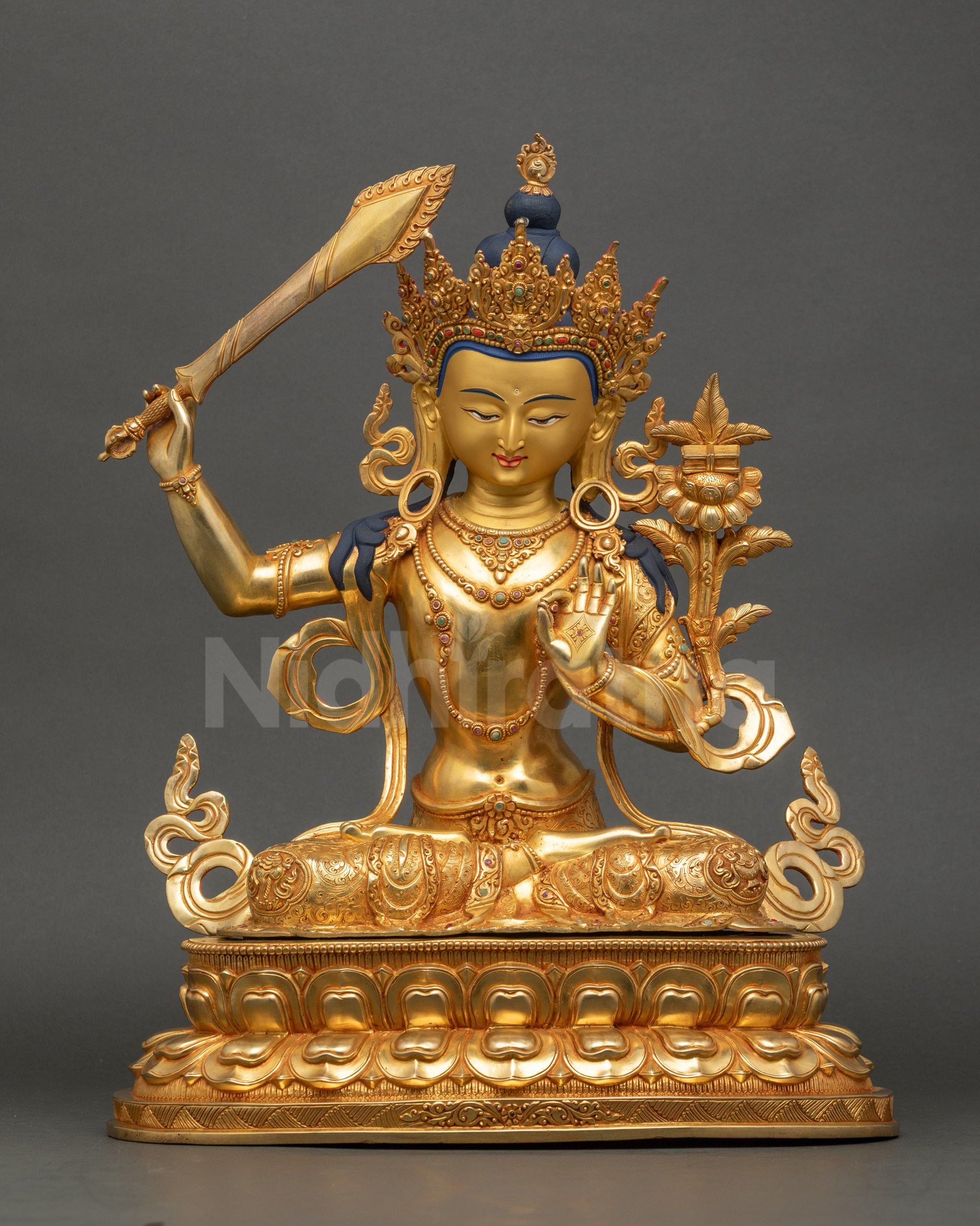 Front view of Manjushri Bodhisattva statue, copper and gold fire-gilded artwork