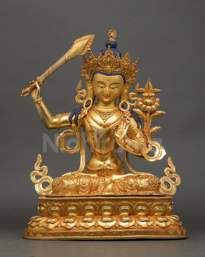 Front view of Manjushri Bodhisattva statue, copper and gold fire-gilded artwork