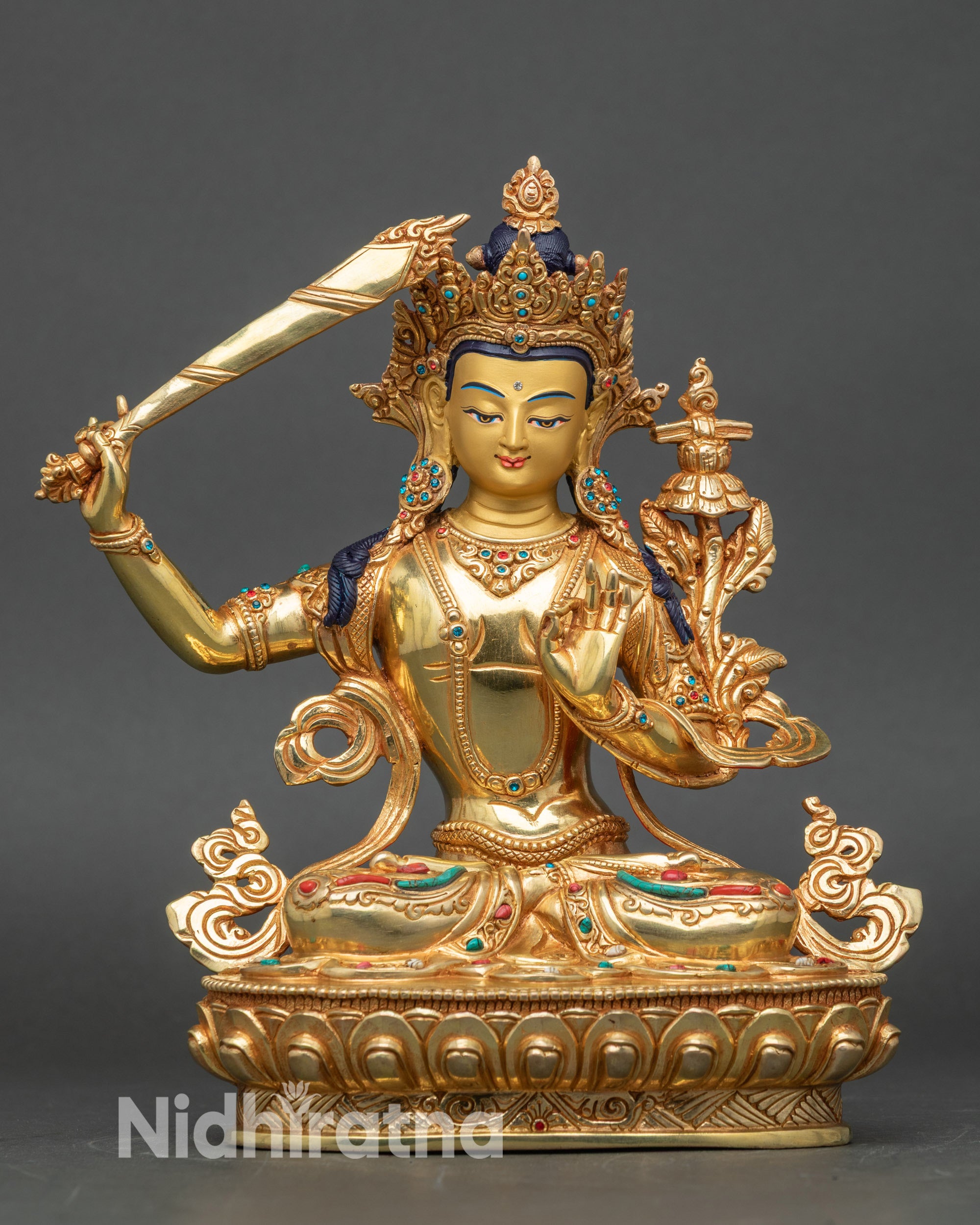 Front view of Manjushri Bodhisattva statue, handcrafted copper and gold fire-gilded Nepalese art