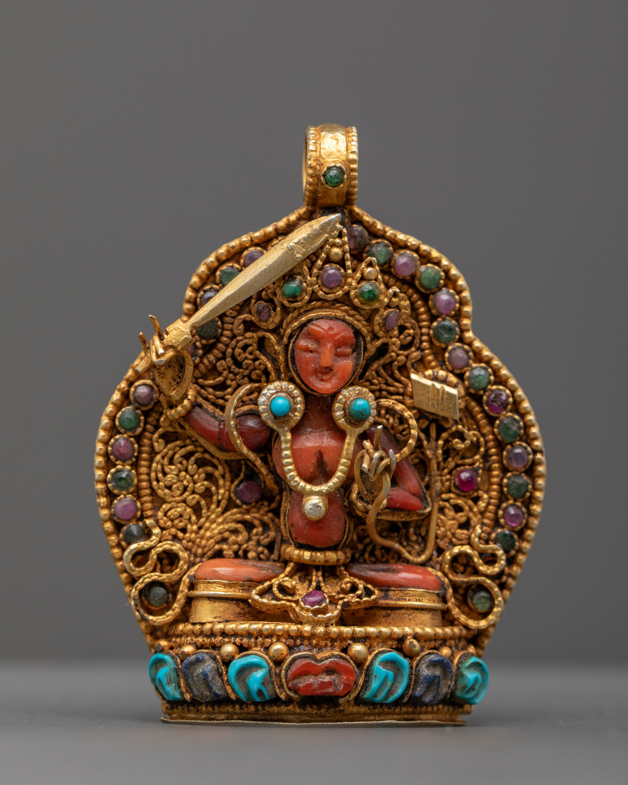 Front view of Manjushri Locket featuring radiant red crystal and gold-gilded filigree, crafted by master artisans from Patan, Nepal.