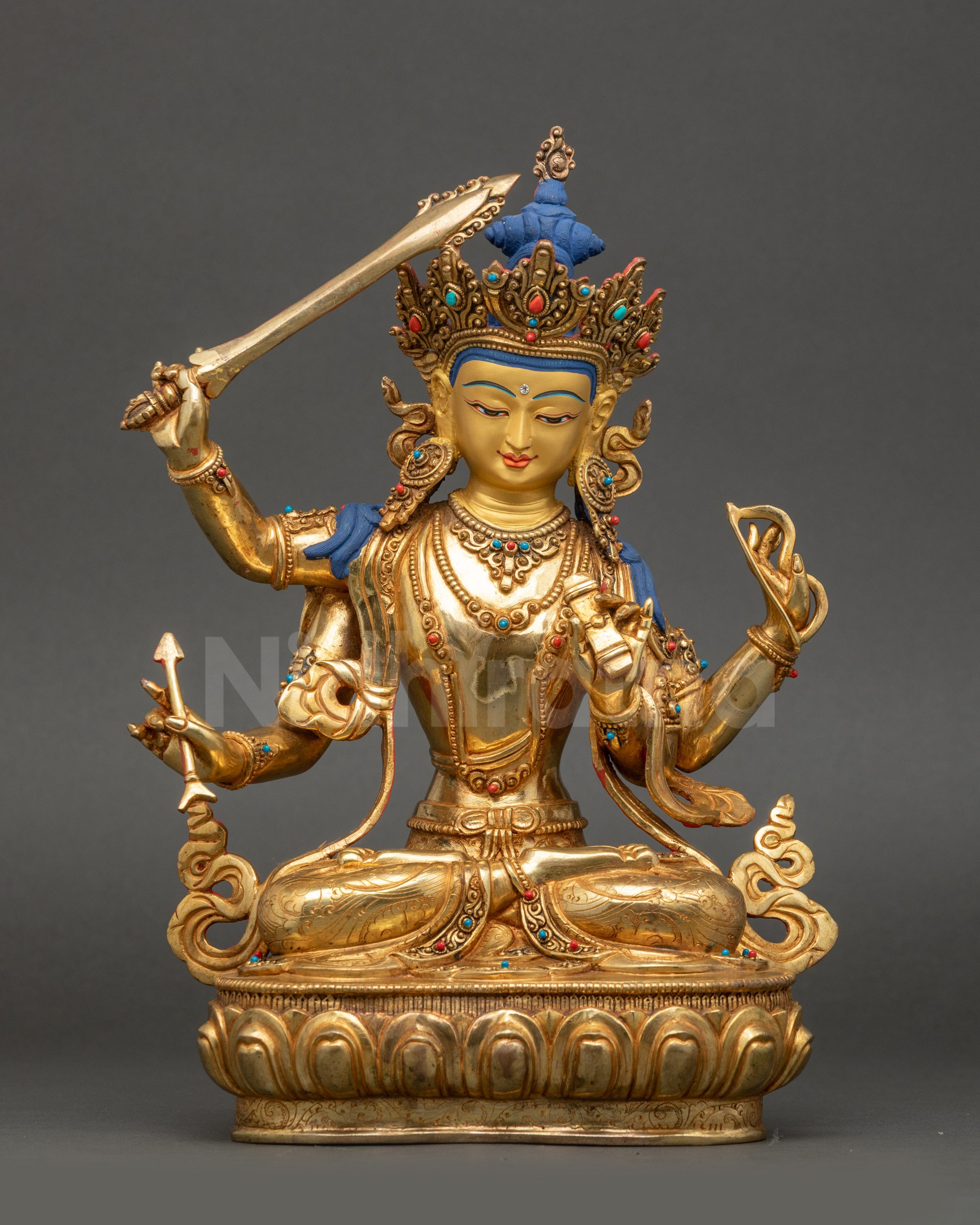 Front view of Manjushri Statue | Handmade Nepalese Buddhist Wisdom Sculpture with 24K gold-painted face and lotus seat