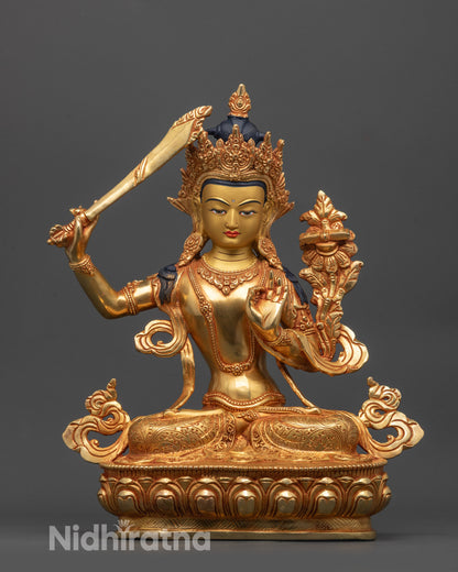 Front view of Manjushri Statue on lotus with flaming sword and Sutra in hand