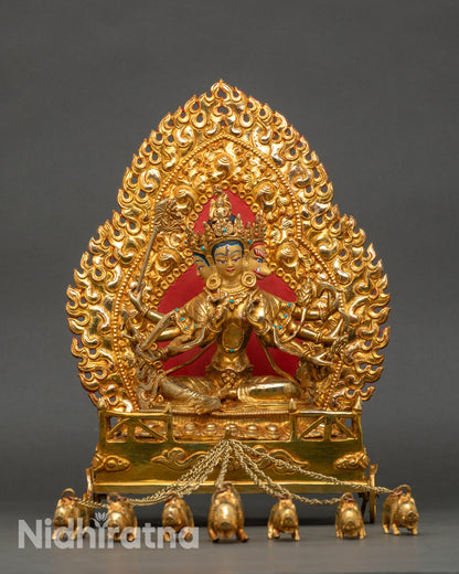 Front view of Marichi statue seated on lotus throne with three heads and eight arms