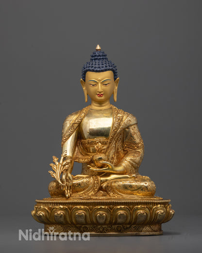 Front view of Medicine Buddha Sculpture with gold-gilded face and healing gesture