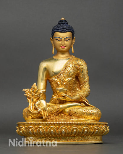 Front view of Medicine Buddha statue, handcrafted copper with gold fire-gilding