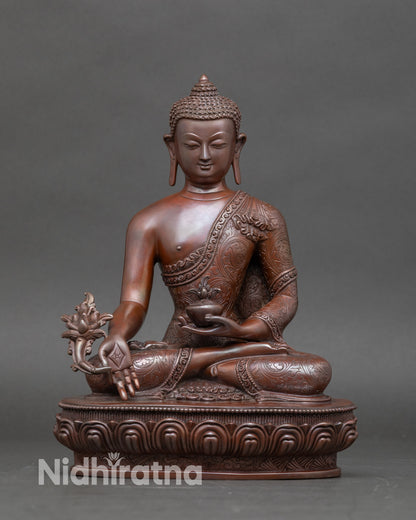 Front view of Medicine Buddha statue for home and office, handcrafted by a Newari artist from Patan, Nepal, seated on a lotus throne with a healing nectar bowl in left hand.