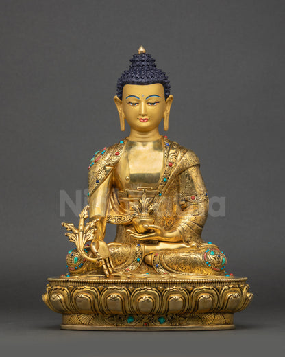 Front view of Medicine Buddha statue with gold-gilded face holding myrobalan stem and bowl