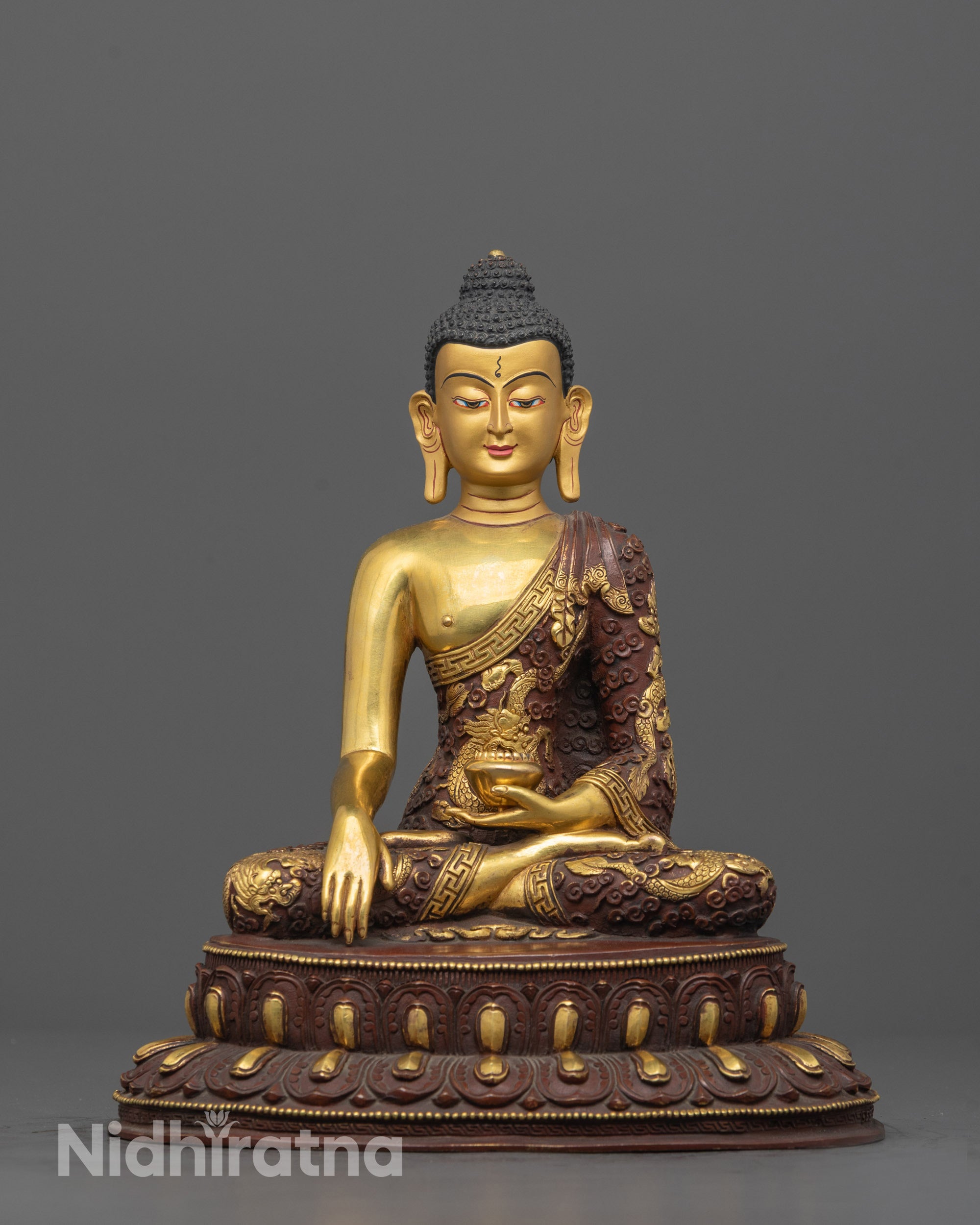 Front view of Meditating Shakyamuni Buddha statue with gold-gilded face and fire-gilded body

