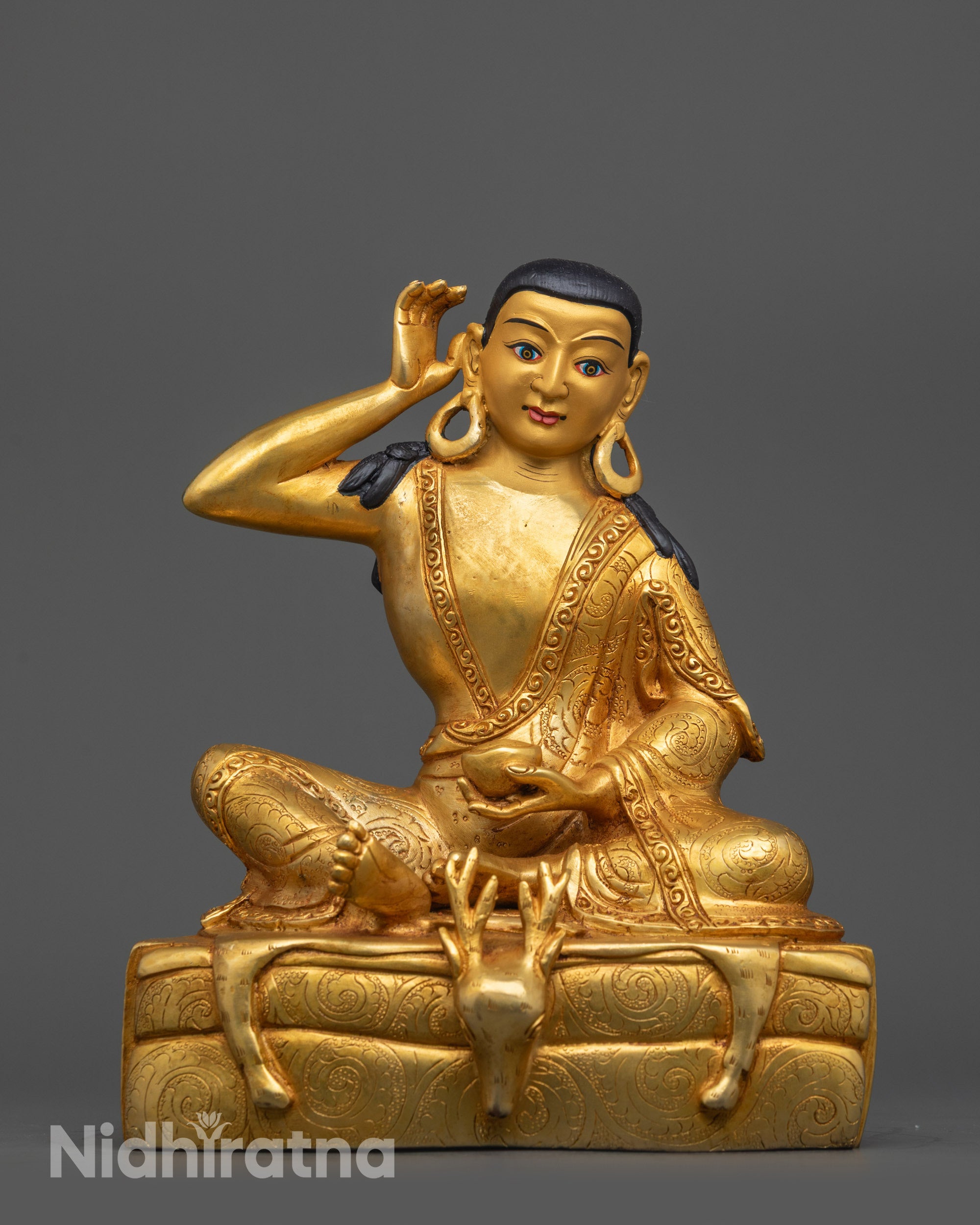 Front view of Milarepa Statue with gold-gilded face and intricate robe on copper base
