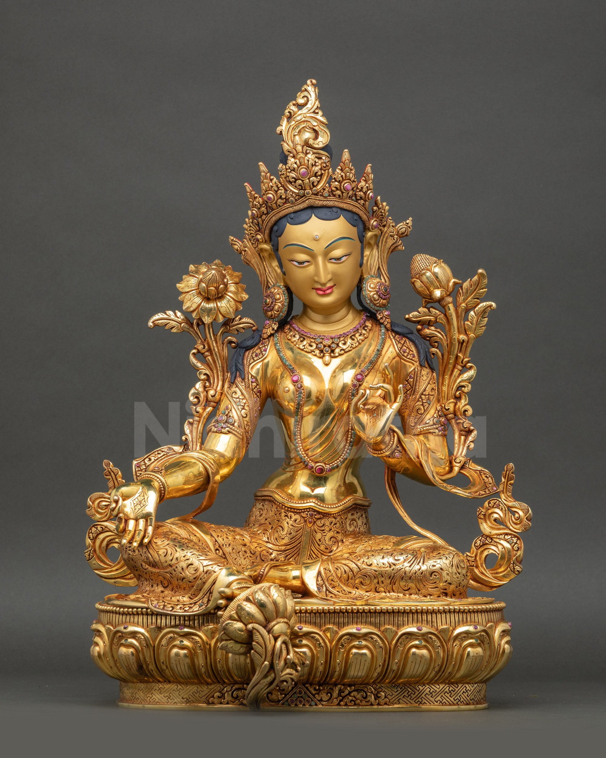 Front view of Mother Green Tara in Lalitasana holding utpala on a lotus seat