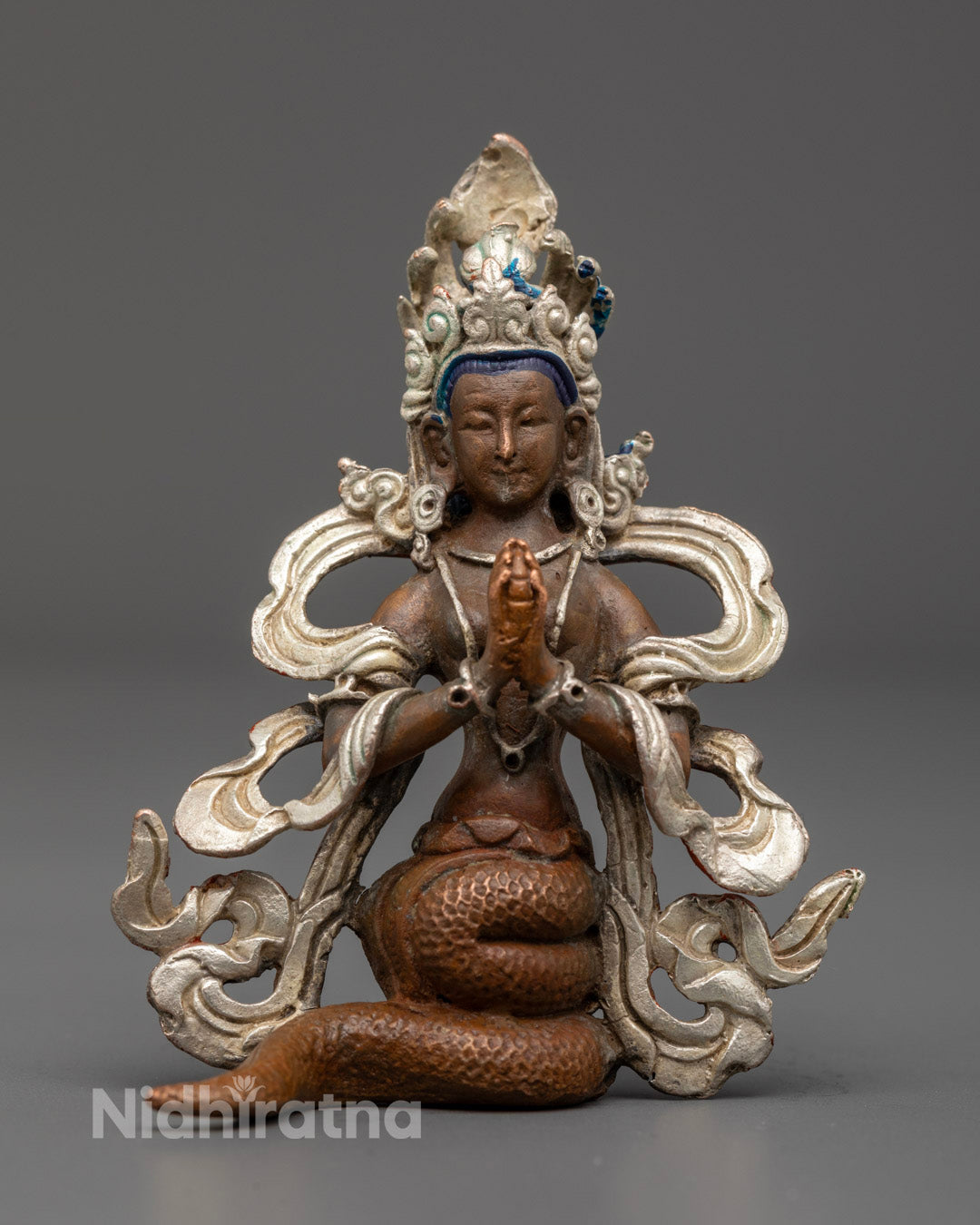 Nagakanya Statue handcrafted from oxidized copper with silver finish, showcasing the Naga Maiden's detailed serpent body and multi-headed cobra hoods.