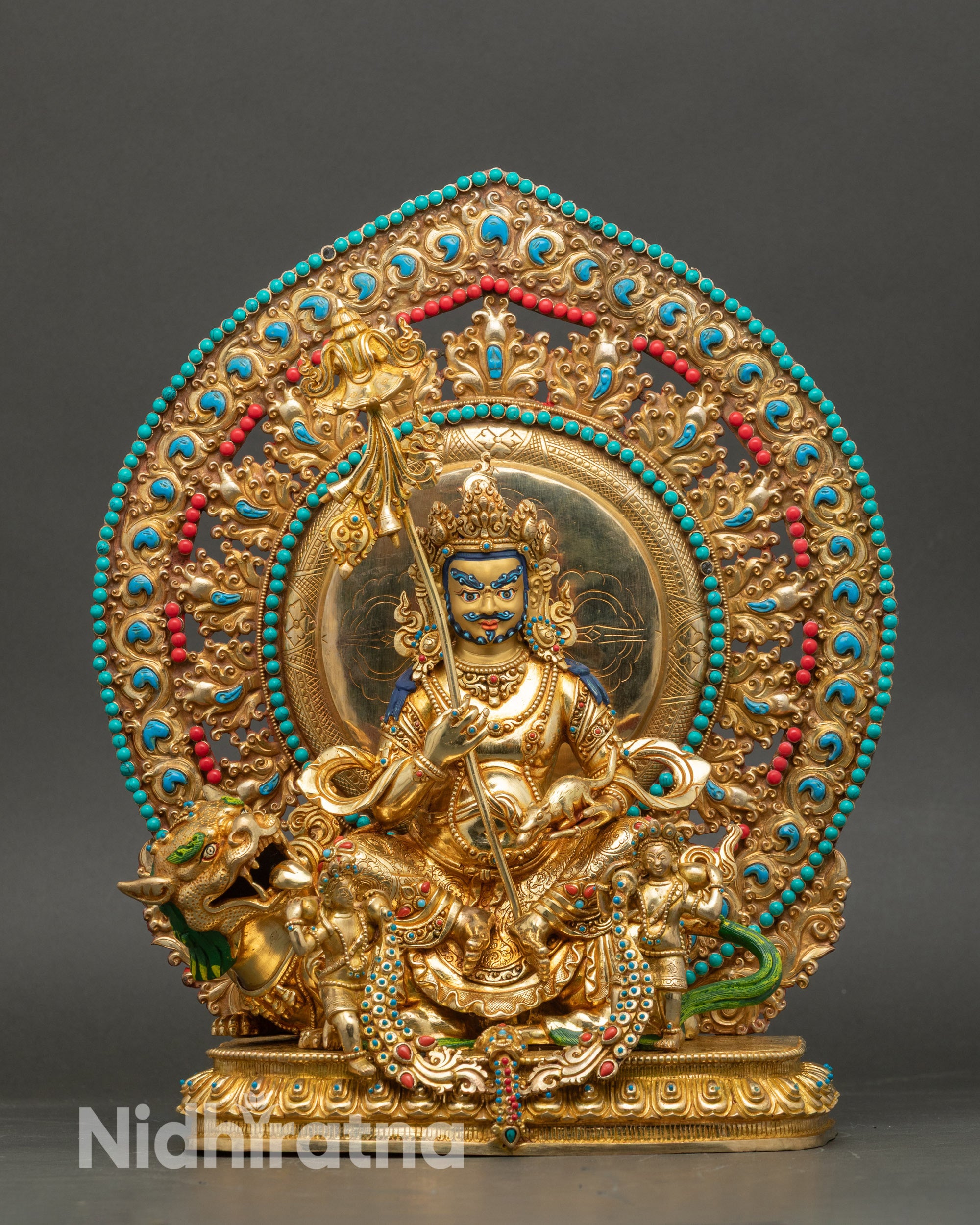Front view of Namtoshe Statue, gold fire-gilded copper, seated on snow lion lotus
