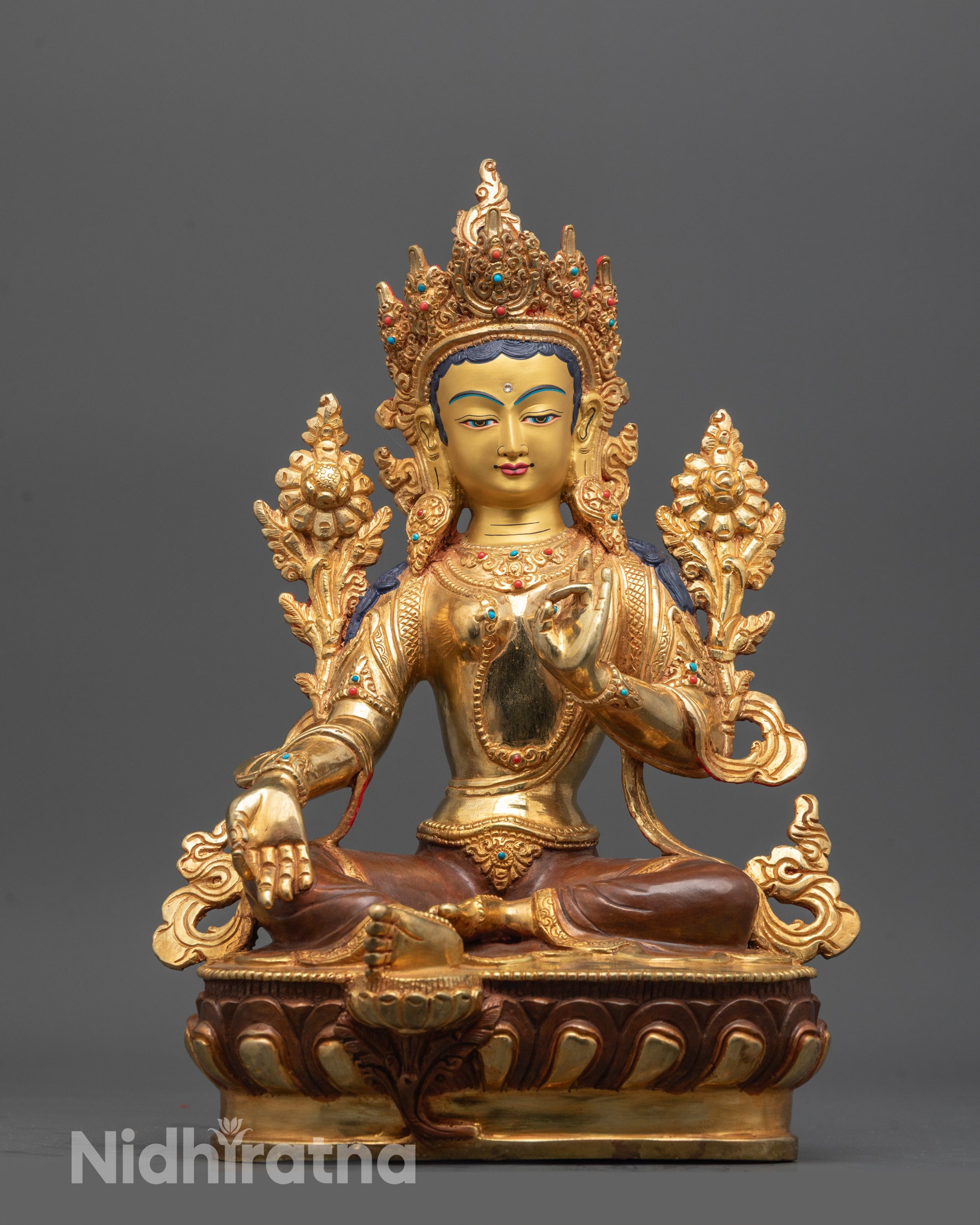 Front view of Nepalese Mother Tara Statue with gold-gilded face and lotus seat
