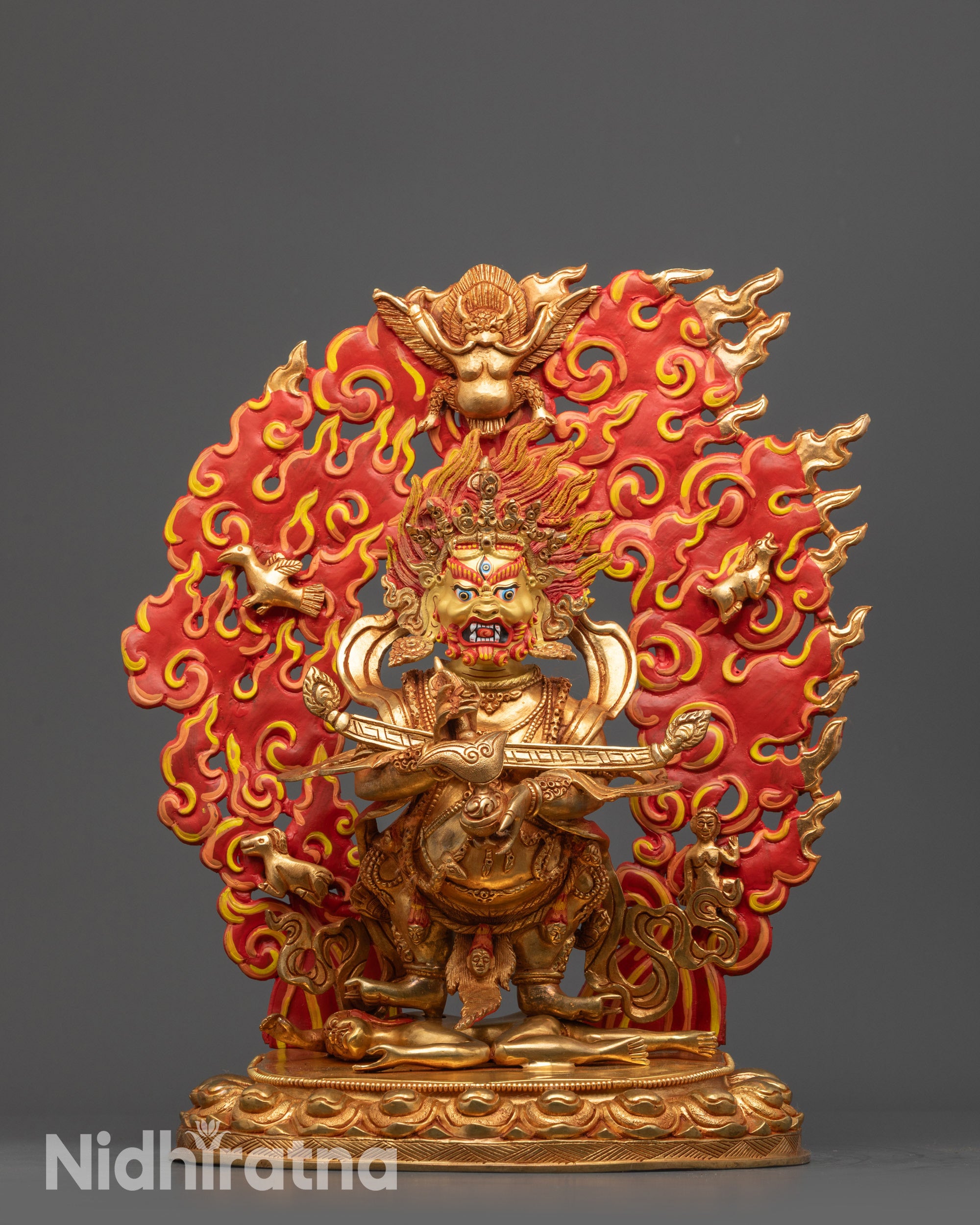Front view of Nepalese Shakya Mahakala Statue with gold-gilded face on lotus seat
