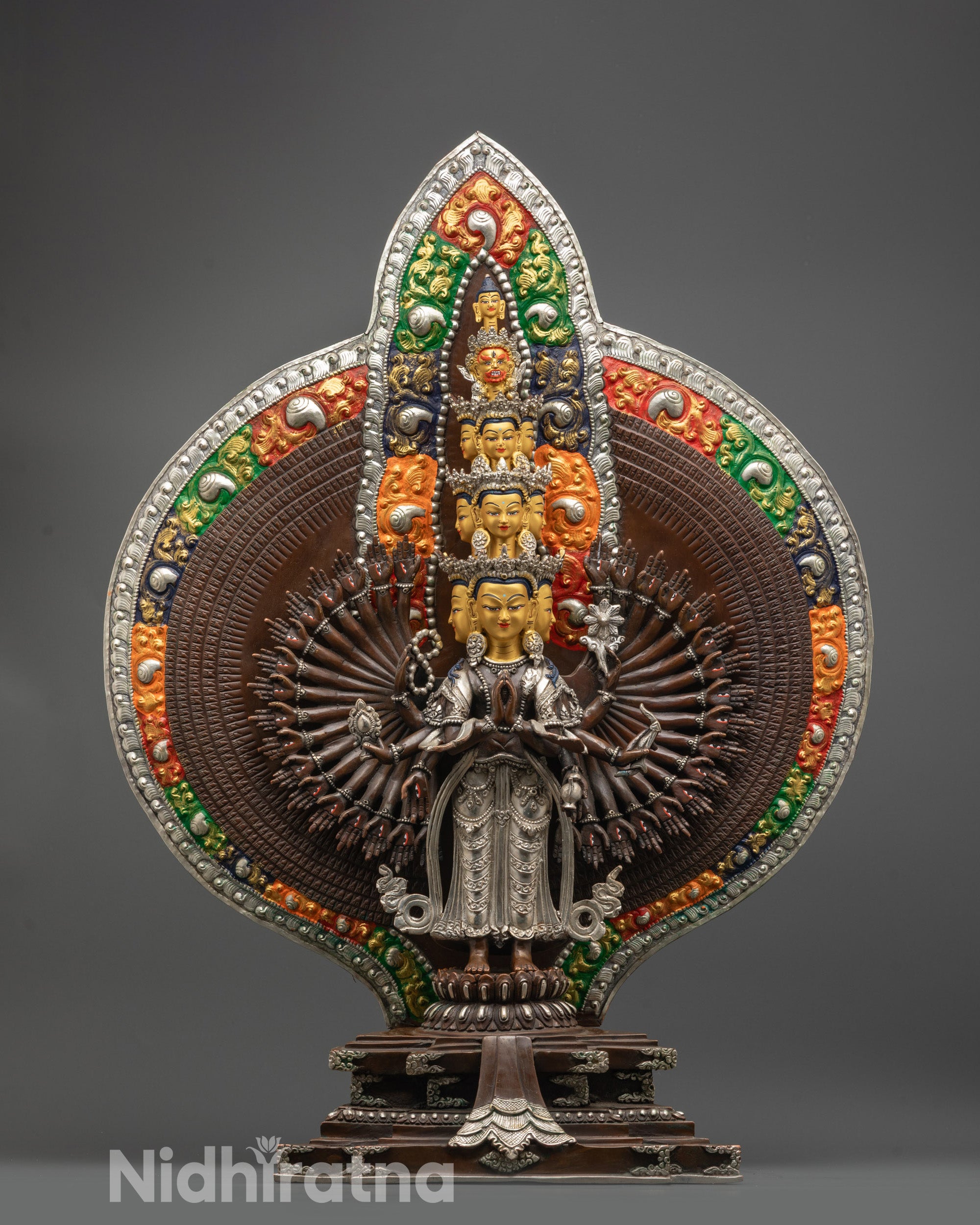 Front view of Oxidized 1000 Armed Chenrezig Statue with gold-gilded faces