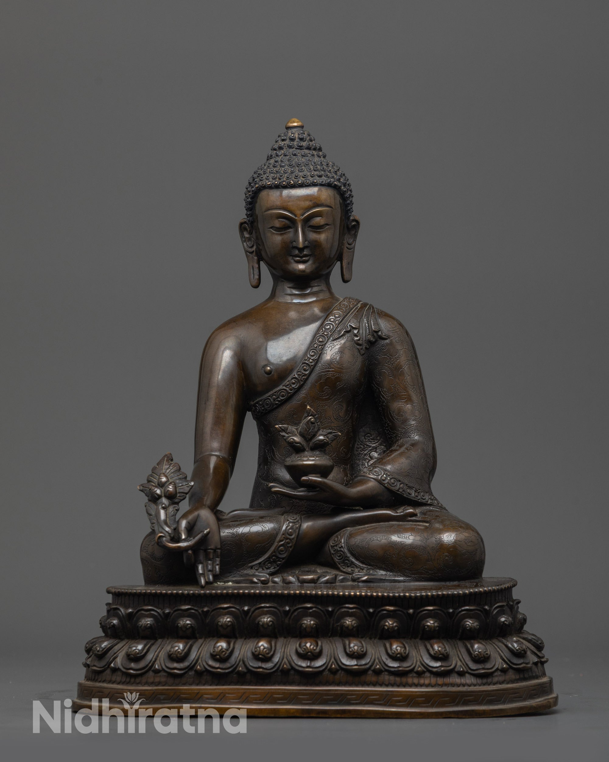 Front view of Oxidized Bhaisajyaguru Buddha Statue with bowl and myrobalan stem