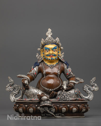 Front view of Oxidized Dzambhala Statue with gold-gilded face and silver-plated oxidized copper body
