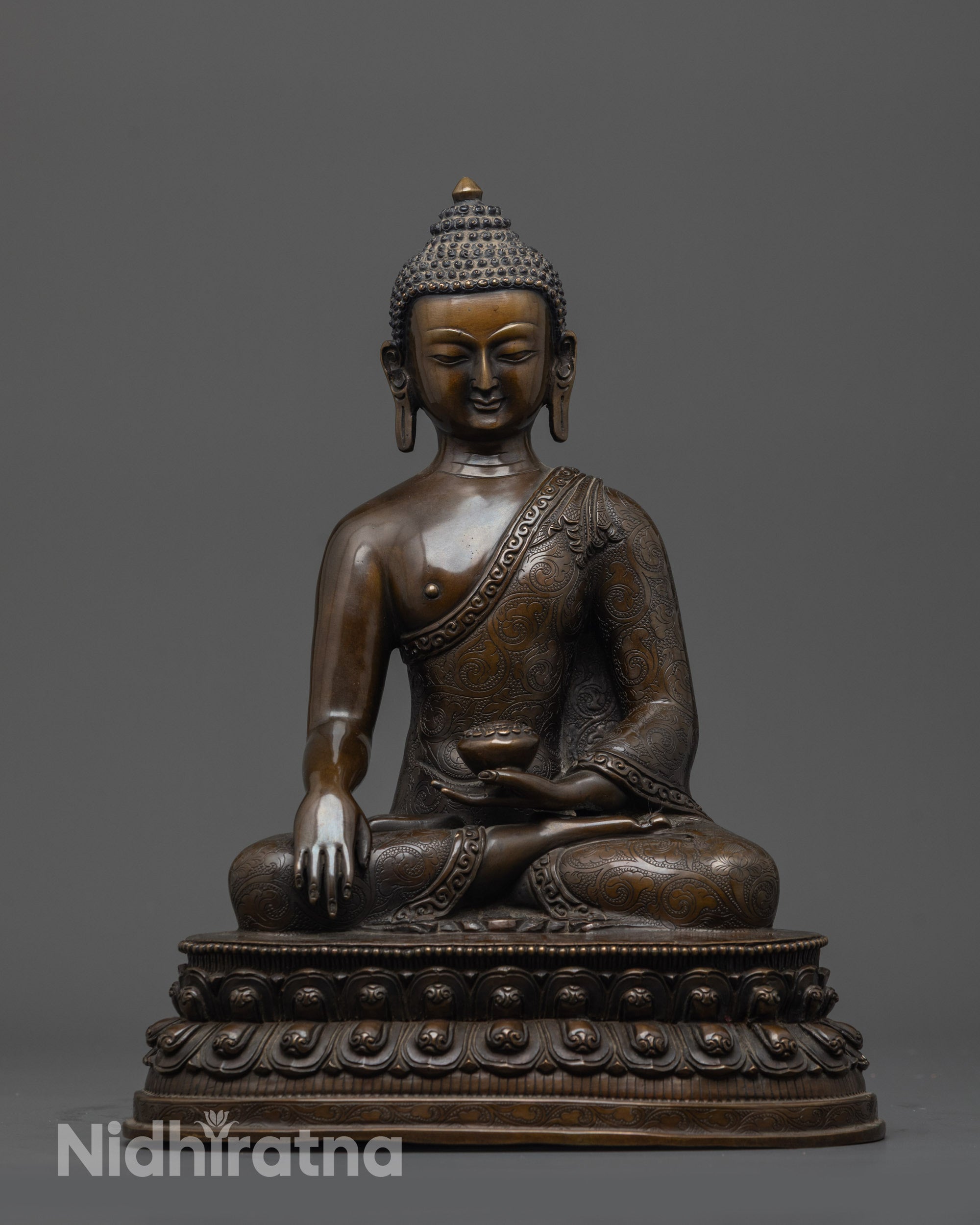 Front view of Oxidized Gautama Buddha Statue showing begging bowl and monk's robe patterns