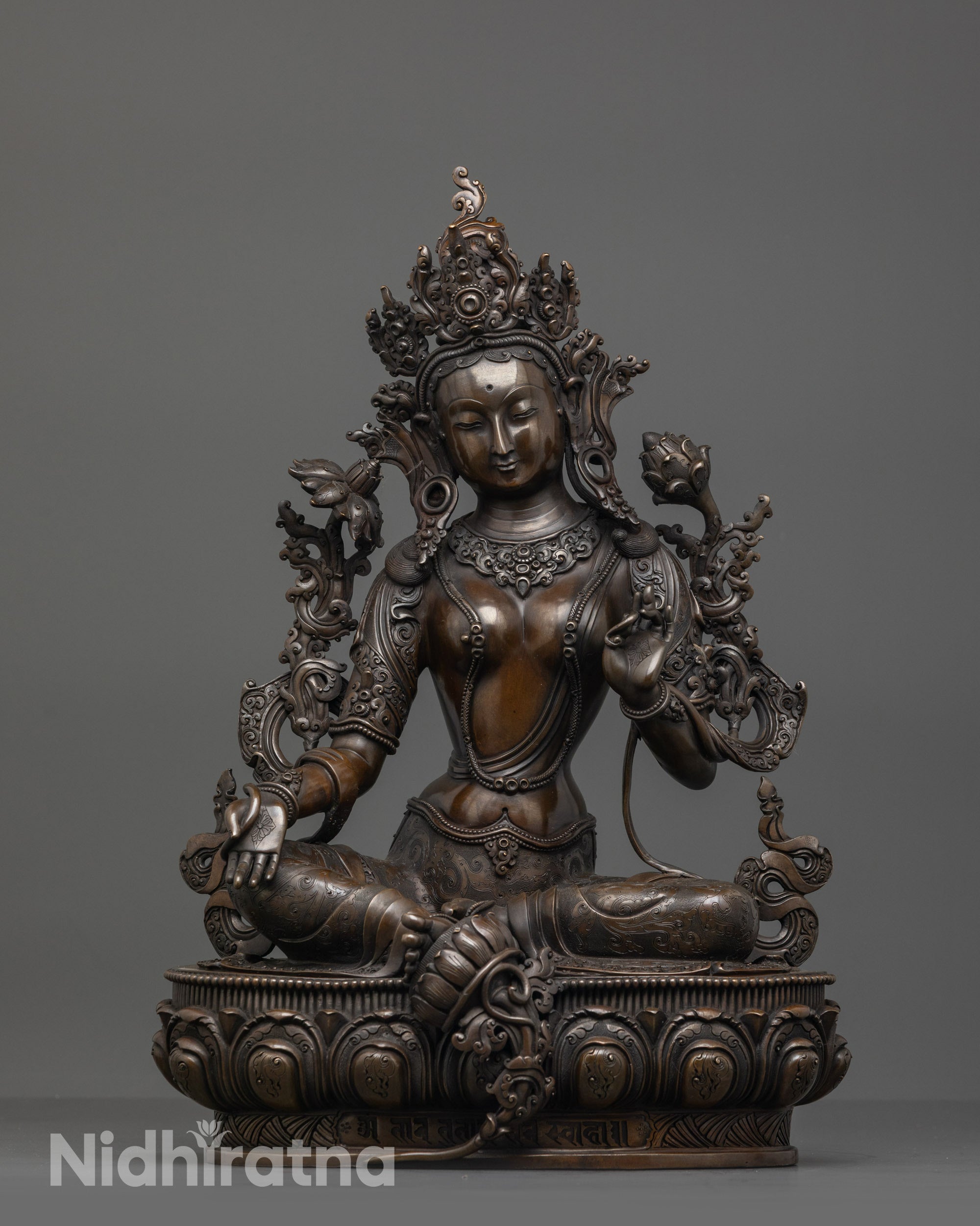 Front view of Oxidized Green Tara Statue on lotus seat with crown and jewelry details