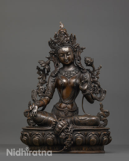 Front view of Oxidized Green Tara Statue on lotus seat with crown and jewelry details