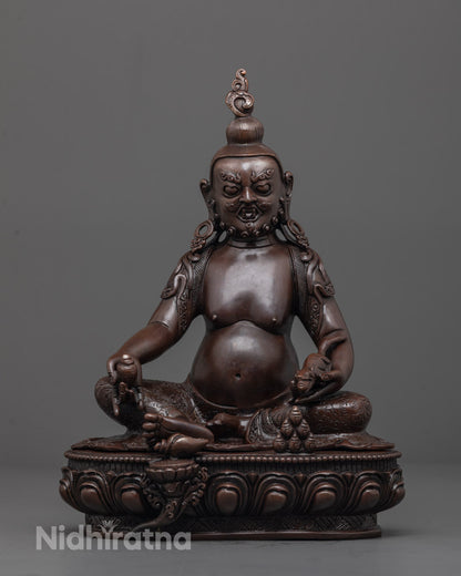 Front view of Oxidized Jambhala Statue with gold-gilded face and citron fruit in hand