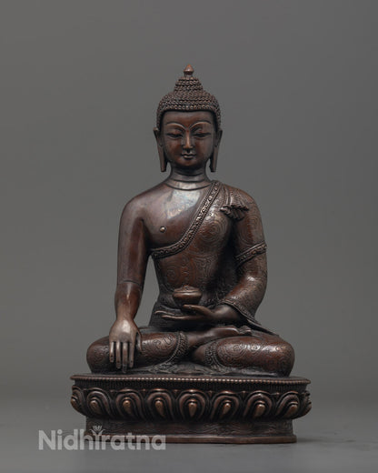 Front view of Oxidized Shakyamuni Buddha Figurine with alms bowl and detailed carvings