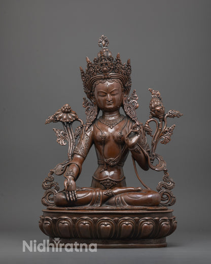 Front view of Oxidized White Tara Statue showing seven eyes and utpala flowers