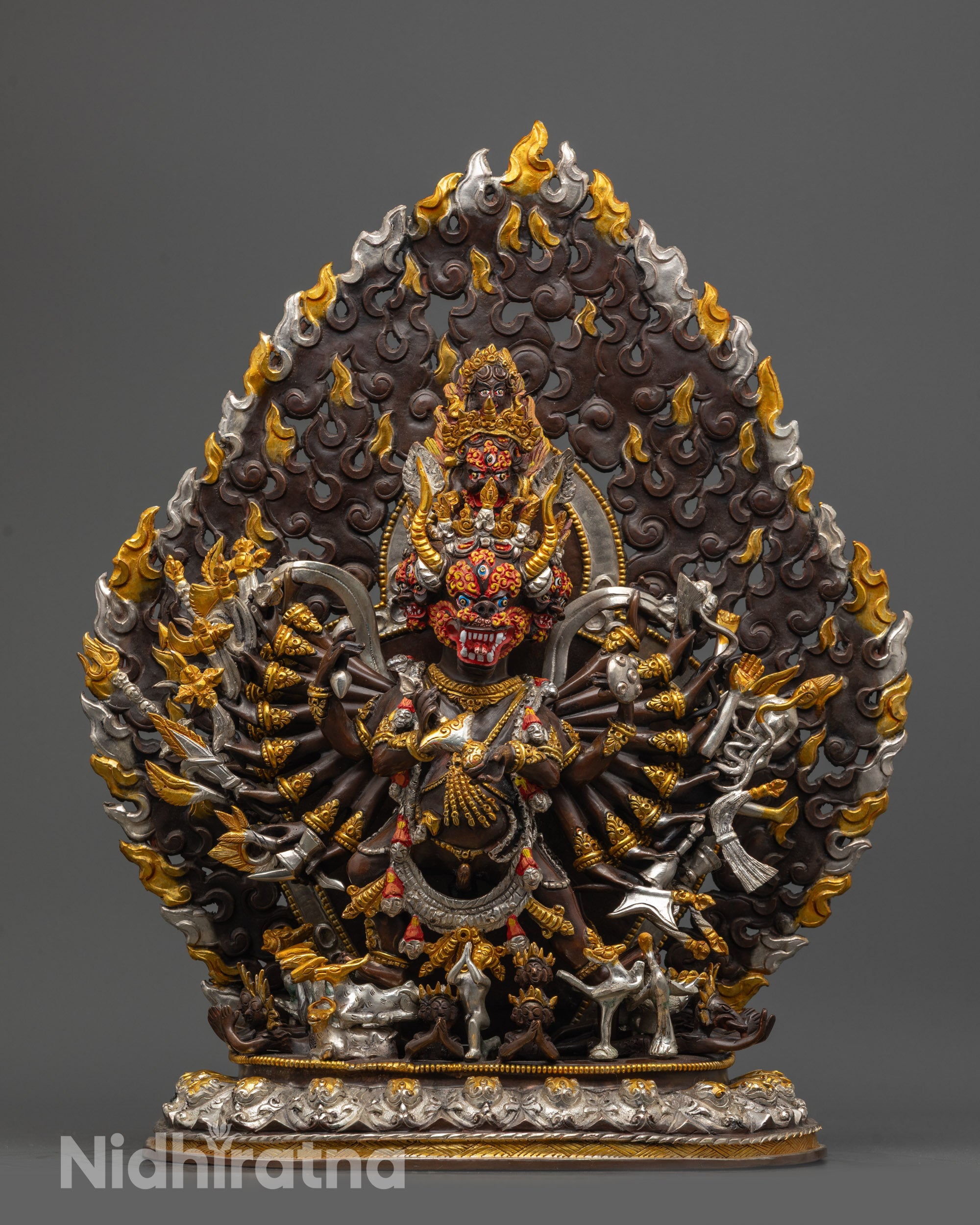 Front view of Oxidized Yamantaka Statue with nine heads and sixteen arms on lotus seat