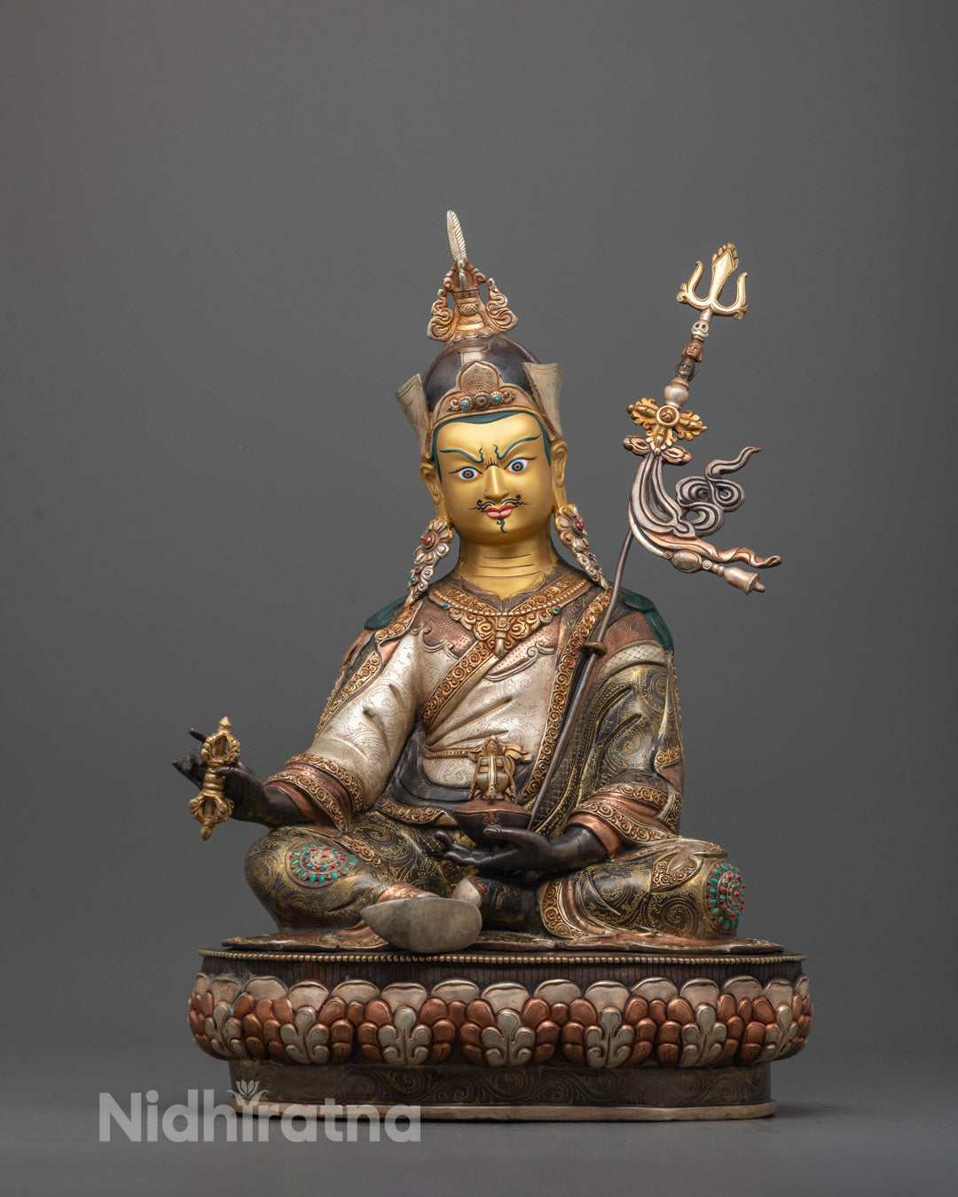 Front view of Padmasambhava Statue with 24K gold-gilded face and lotus crown seated on engraved lotus seat