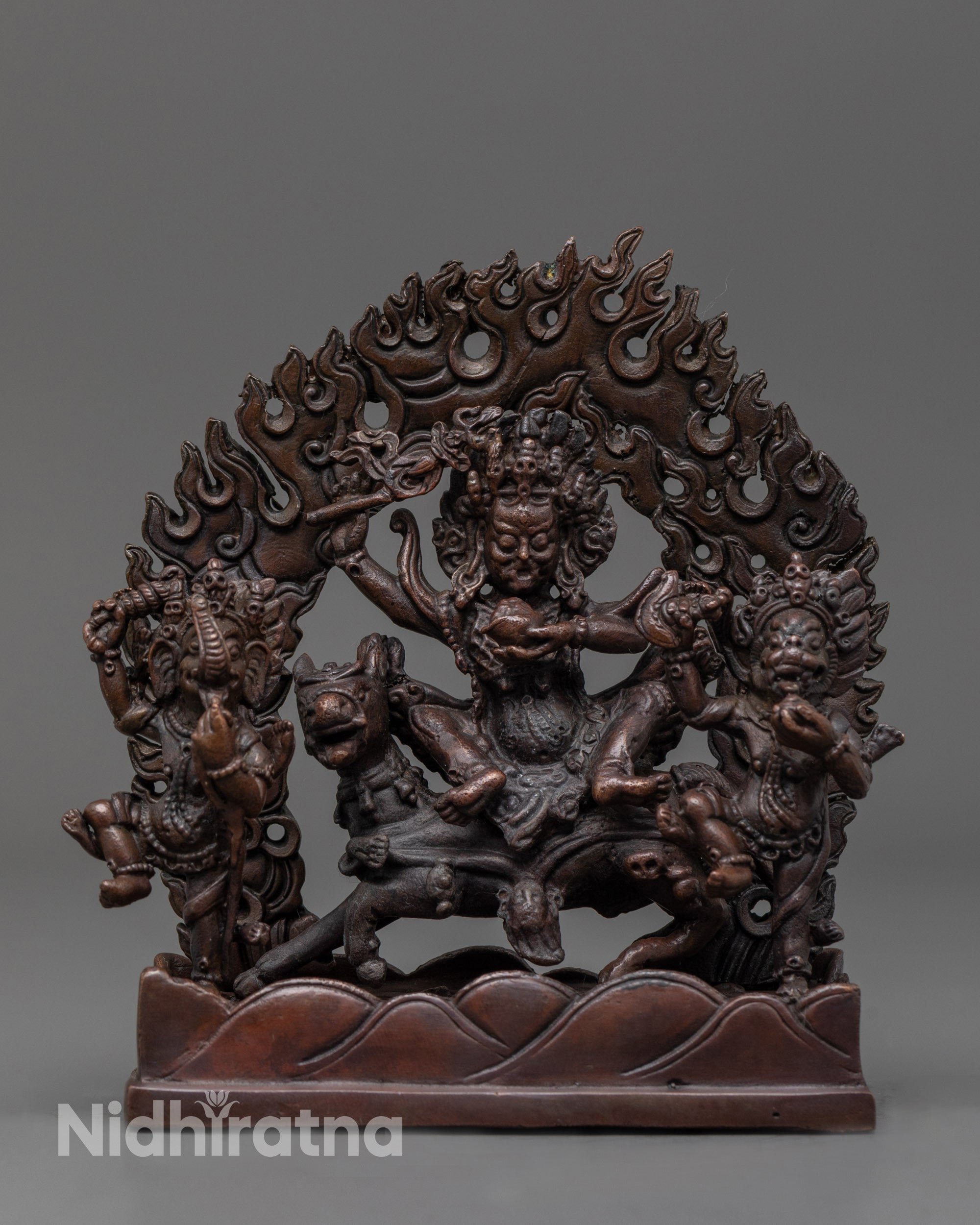 Front view of Palden Lhamo Statue with oxidized copper and sacred trident details