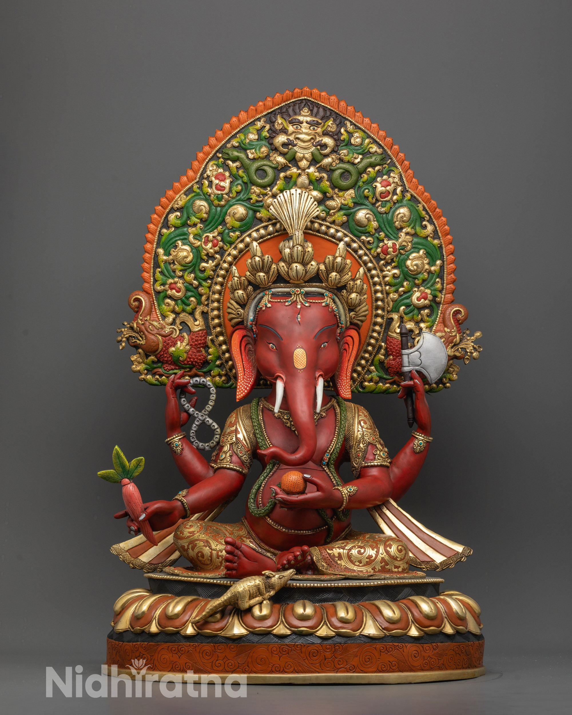 Front view of Red Coloured Lord Ganesha Statue with gold-plated lotus base and hal