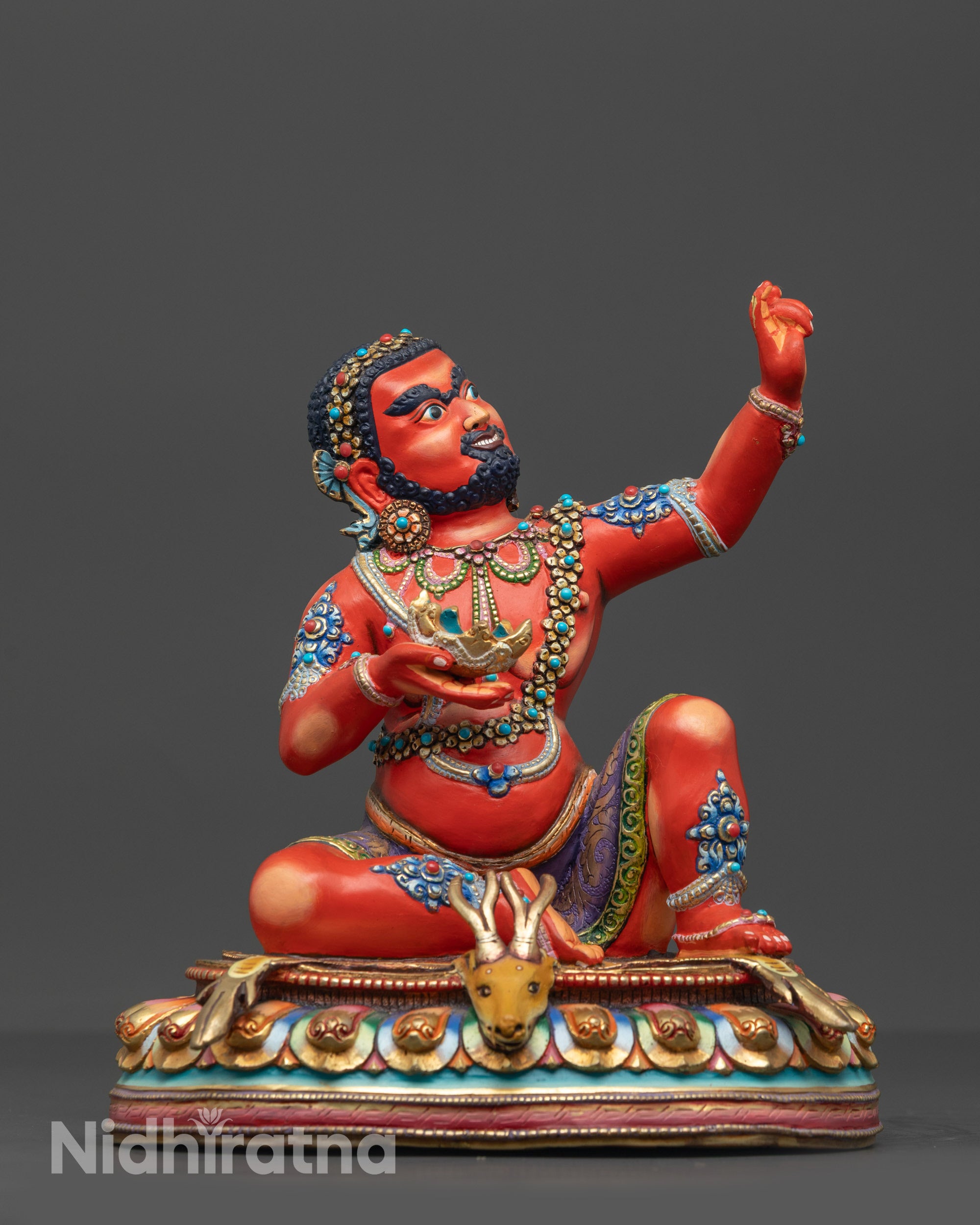 Front view of Red Hued Virupa Statue on lotus with skull cup and striped deer skin