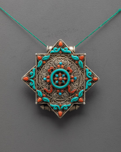 Front view of Sacred Dharma Wheel Locket with turquoise center and silver filigree