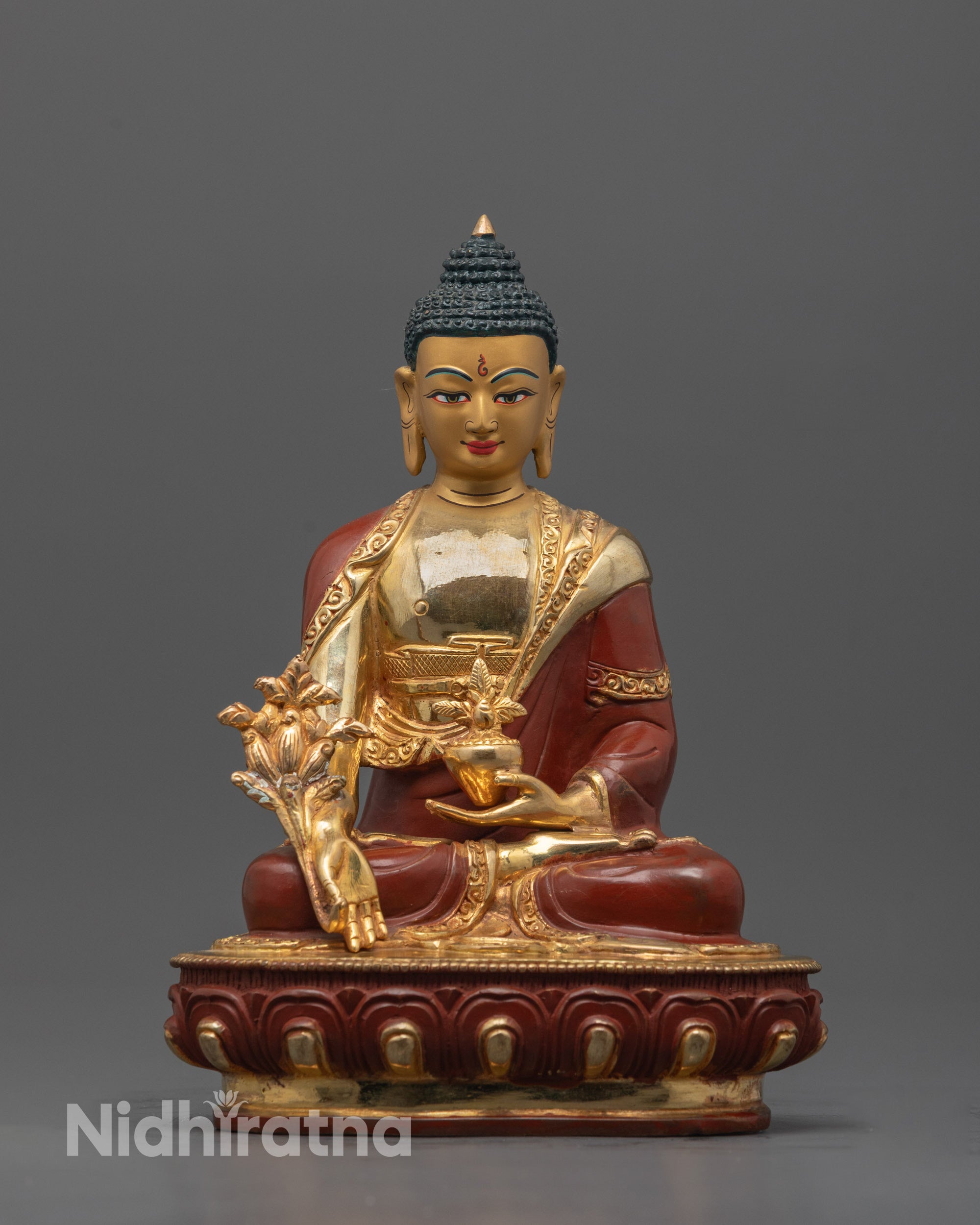 Front view of Sacred Medicine Buddha Statue with gold-gilded face and detailed carvings