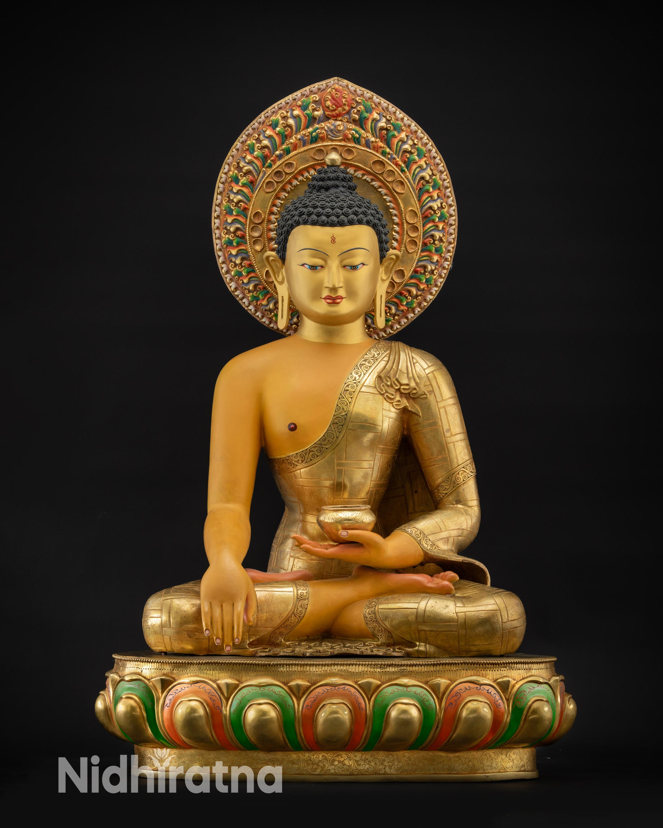 Front view of Shakyamuni Buddha Siddhartha Gautama Statue gold-gilded face
