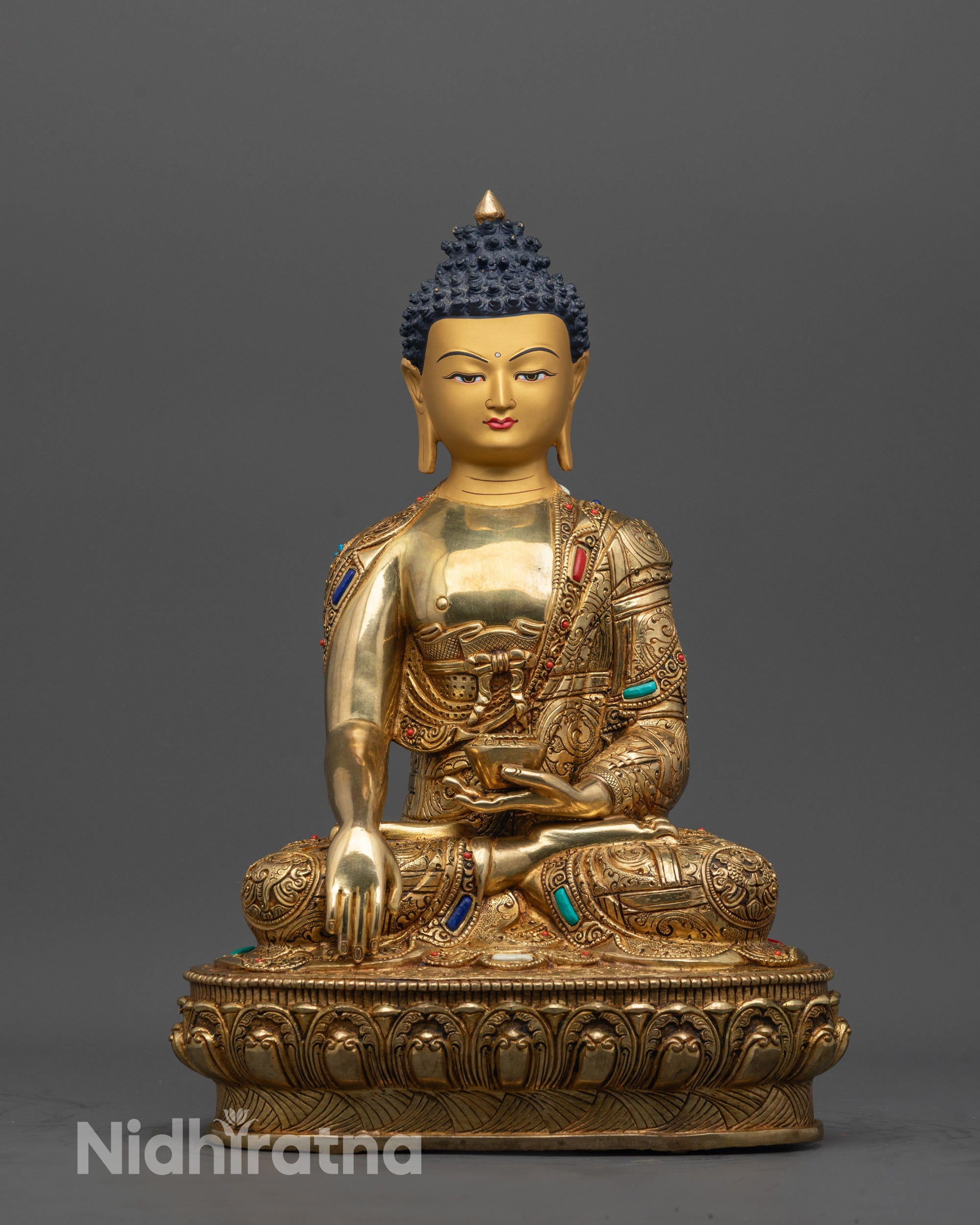 Front view of Shakyamuni Buddha Statue with gold-gilded face and 24K fire gold body